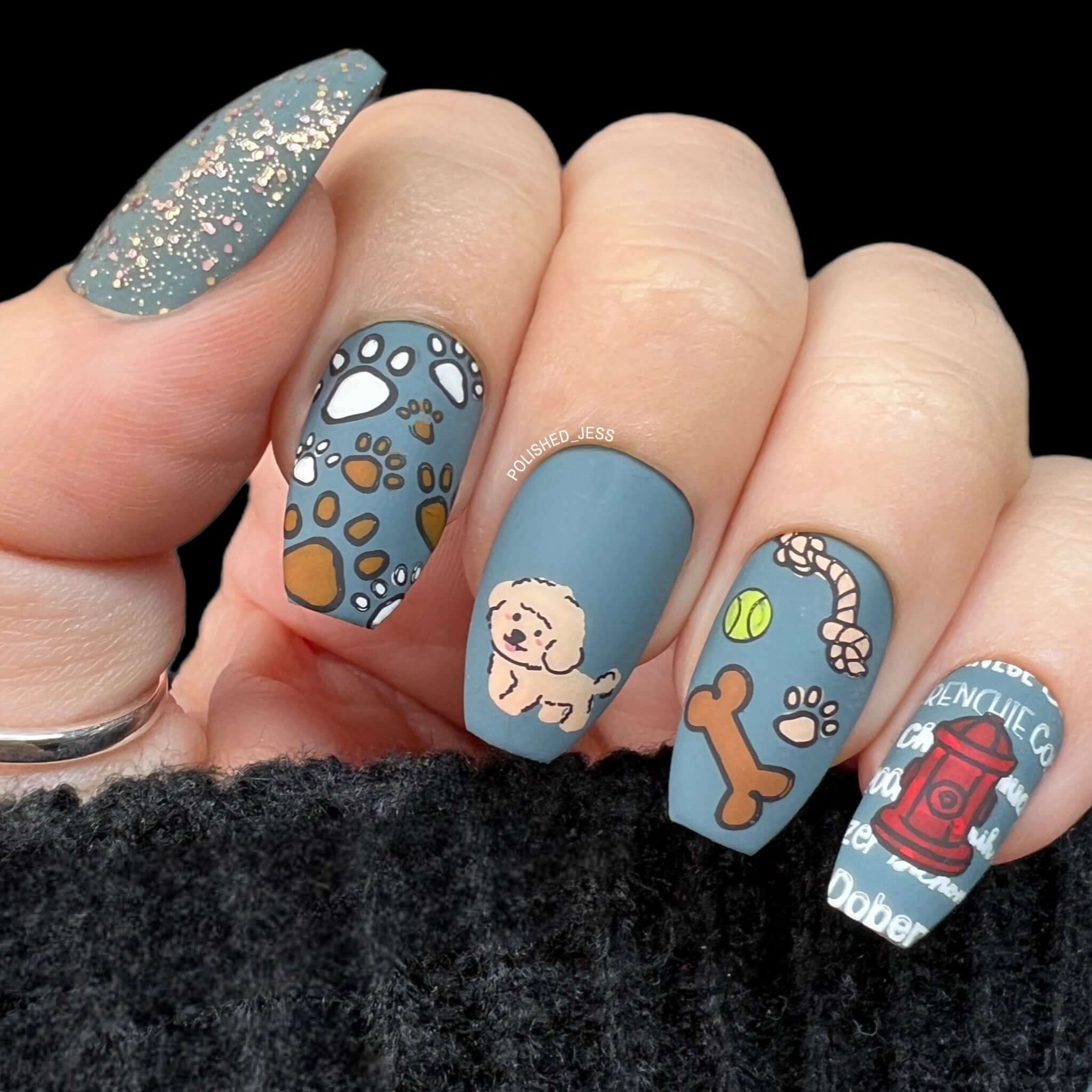 manicure-showing-nail-art-designs-of-dogs-bones-and-paw-prints