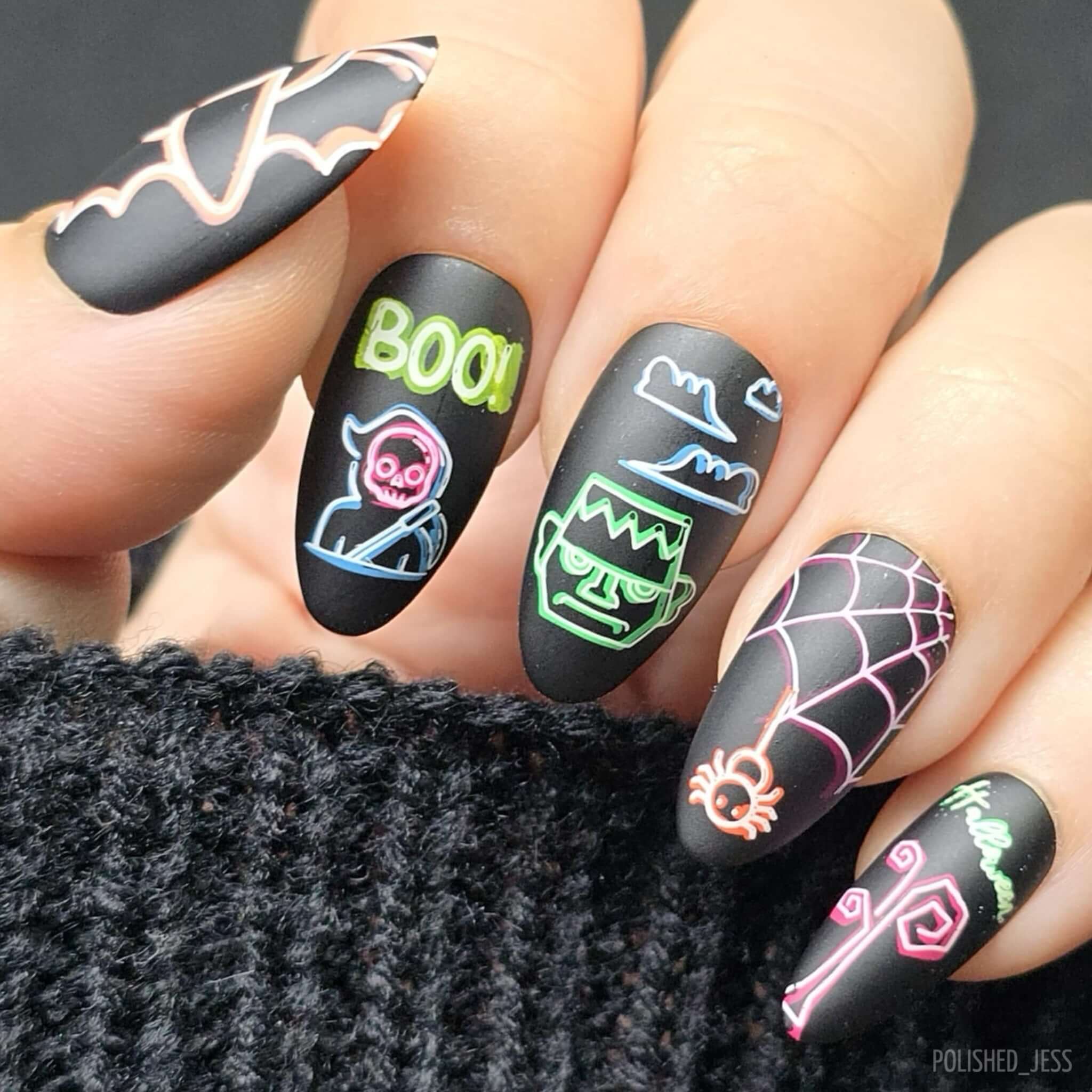 stunning-neon-manicure-with-nail-art-designs-of-spiders-frankenstein-and-a-bat