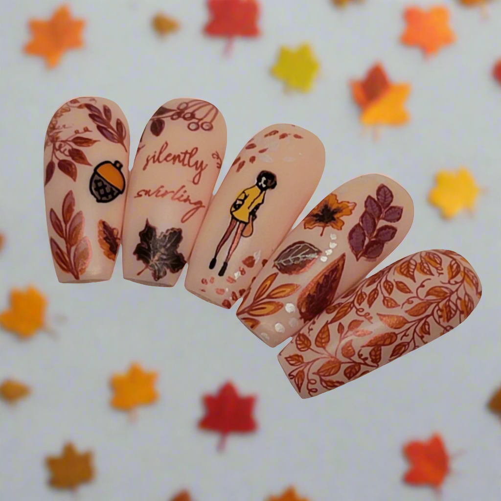 set-of-nail-tips-with-autumn-nail-art-designs-of-leaves-acorns-a-girl-and-the-wrods-silently-swirling