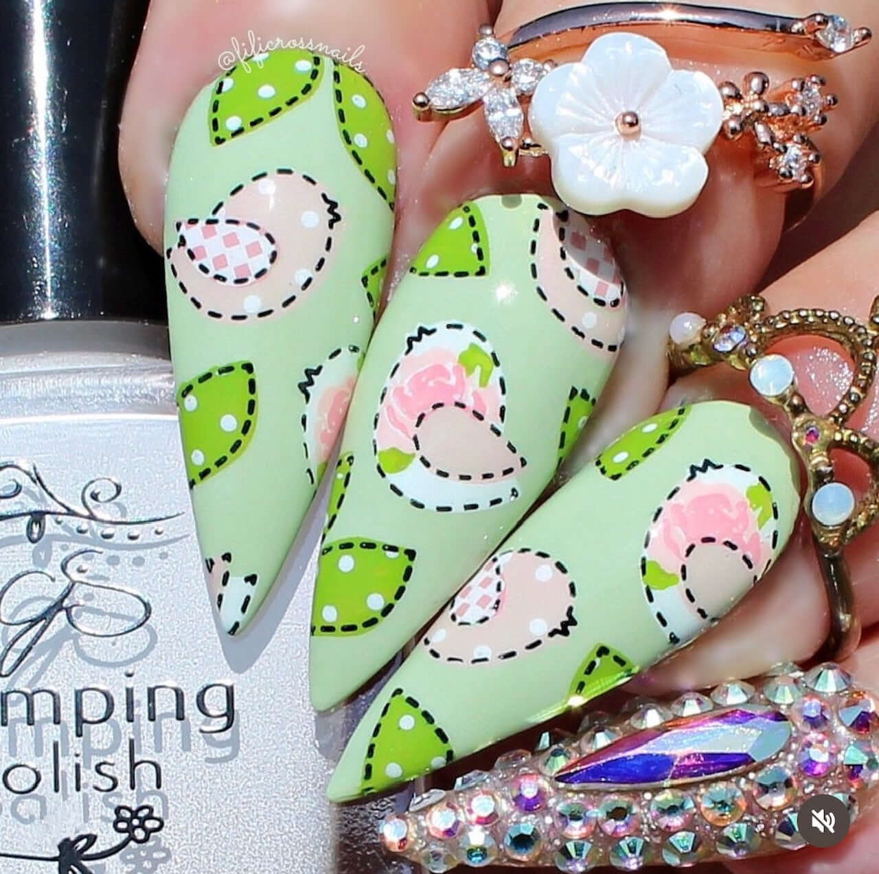 bright-manciured-hand-with-nail-art-designs-of-birds-and-leaves