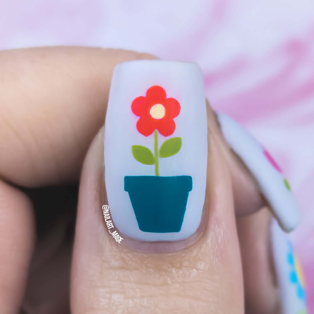 a-single-manciured-nail-showing-stamping-nail-art-design-of-a-flower-in-a-plant-pot