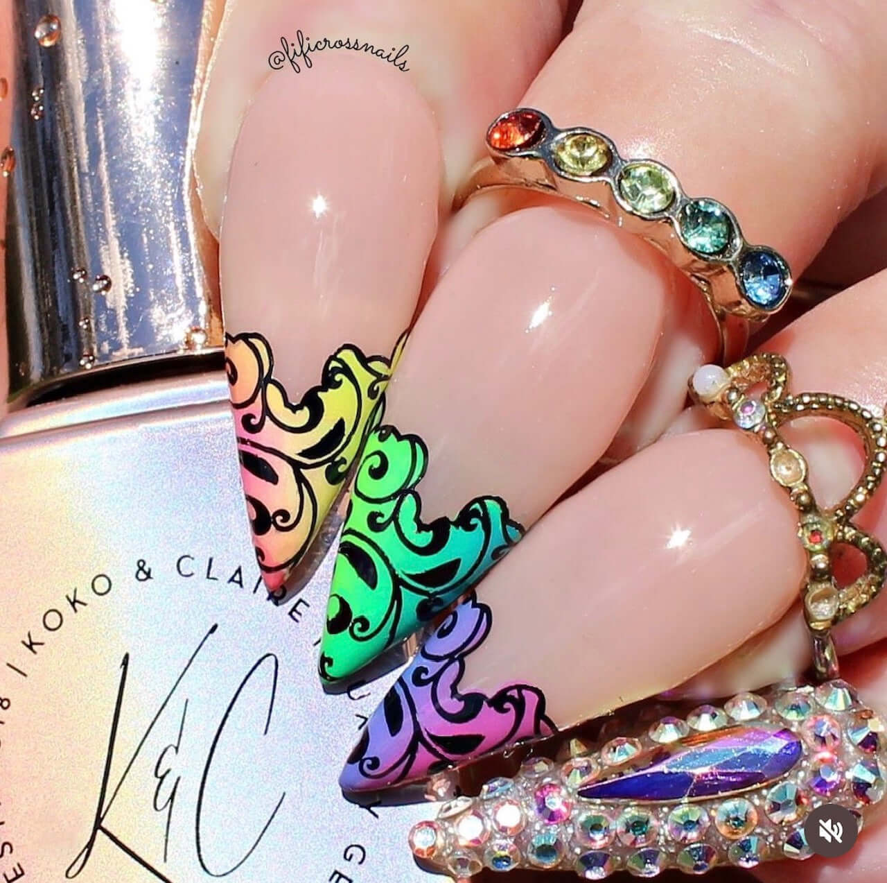 stunning-manicure-showing-french-tips-with-swirled-nail-art-designs