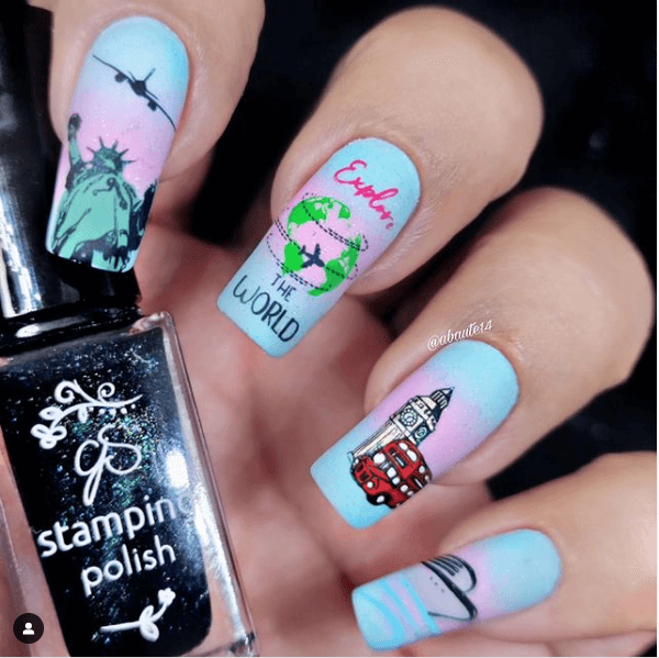 beautiful-manicure-showing-nail-art-designs-of-the-statue-of-liberty-planes-big-ben-and-london-bus