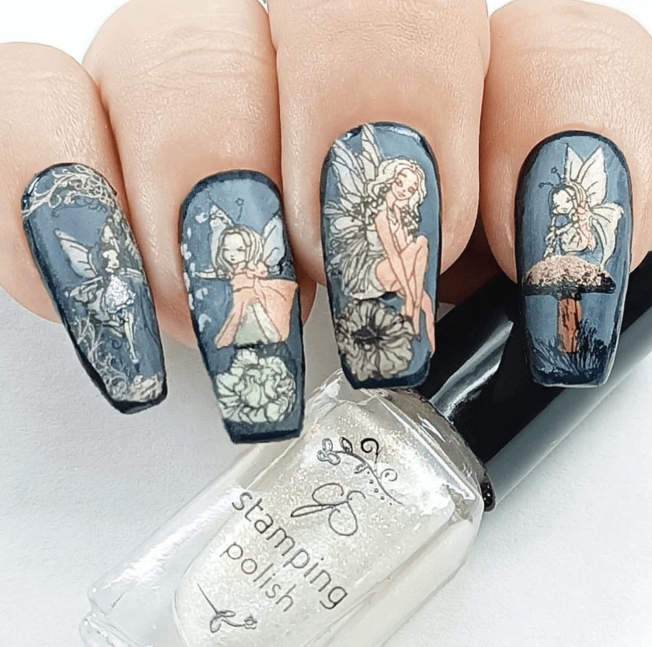 beautiful-manicure-showing-nail-art-designs-of-fairies-on-mushrooms-and-flowers