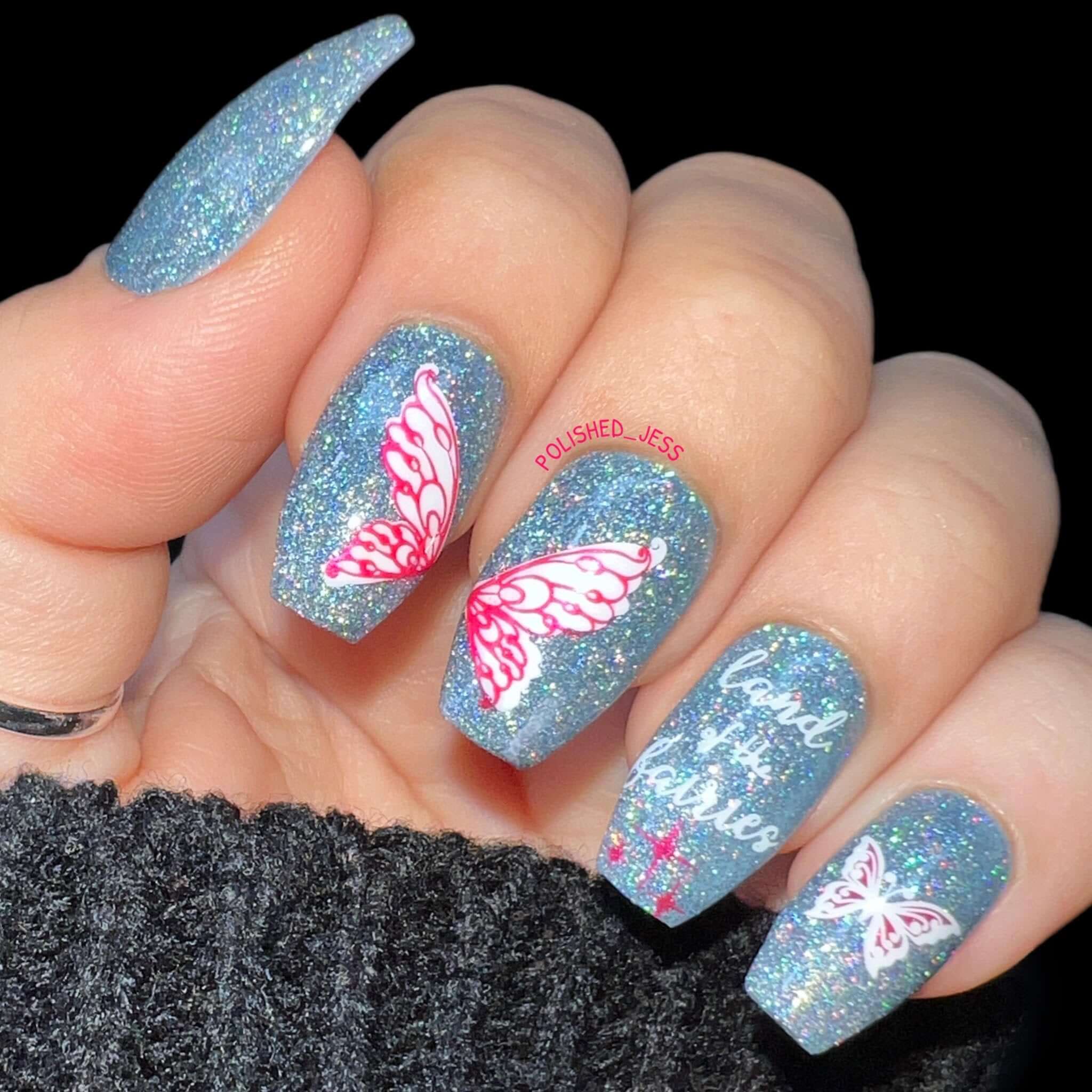 glitter-manicure-showing-nail-art-designs-of-fairy-wings-and-the-words-land-of-the-fairies