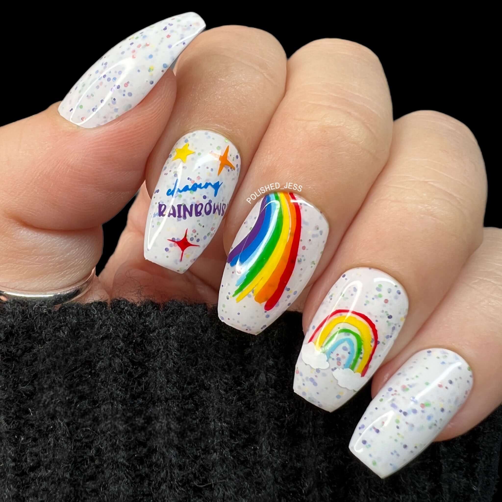 bright-manicure-showing-nail-art-designs-of-rainbows-with-the-words-chasing-rainbows