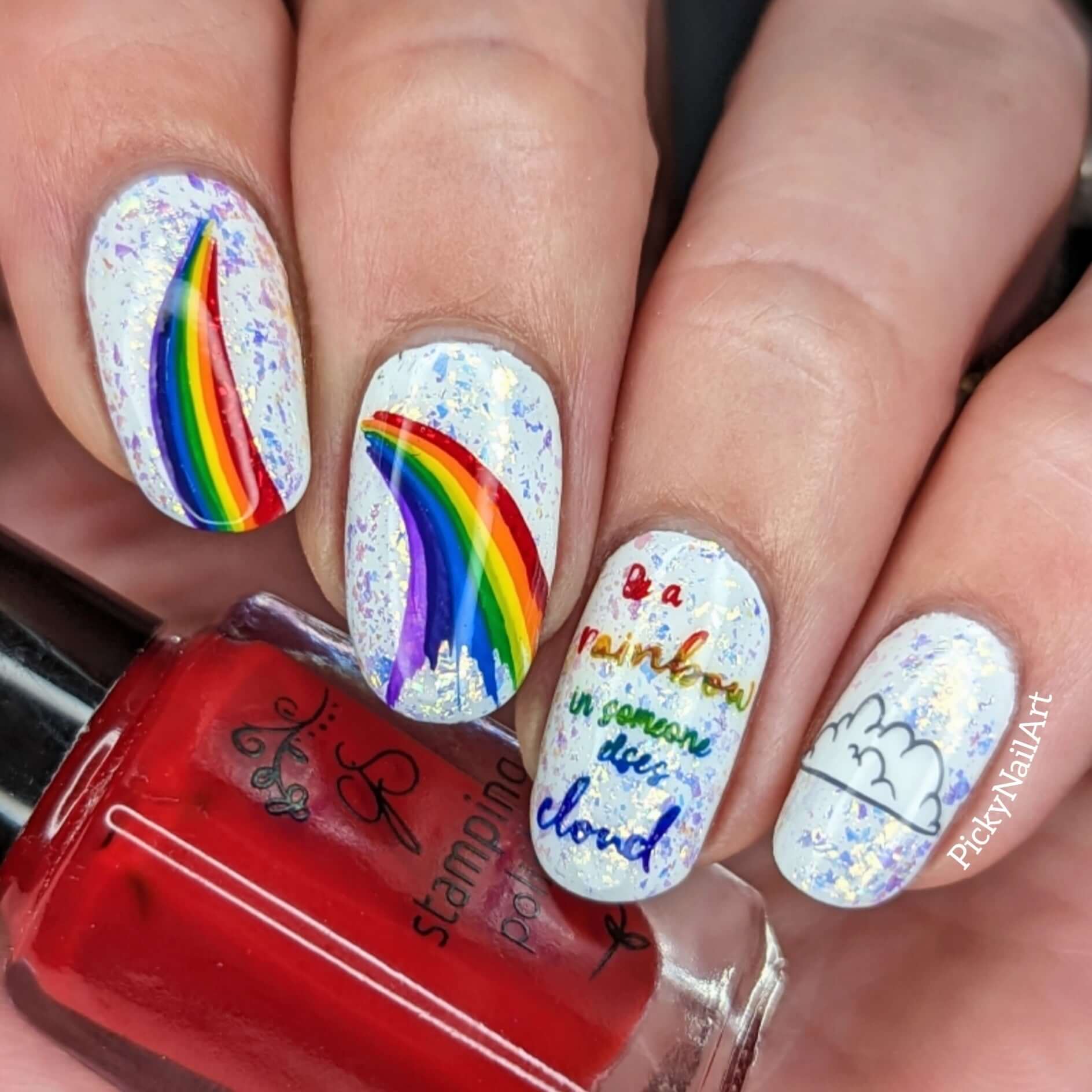 manicure-showing-nail-art-designs-of-rainbows-and-cloud