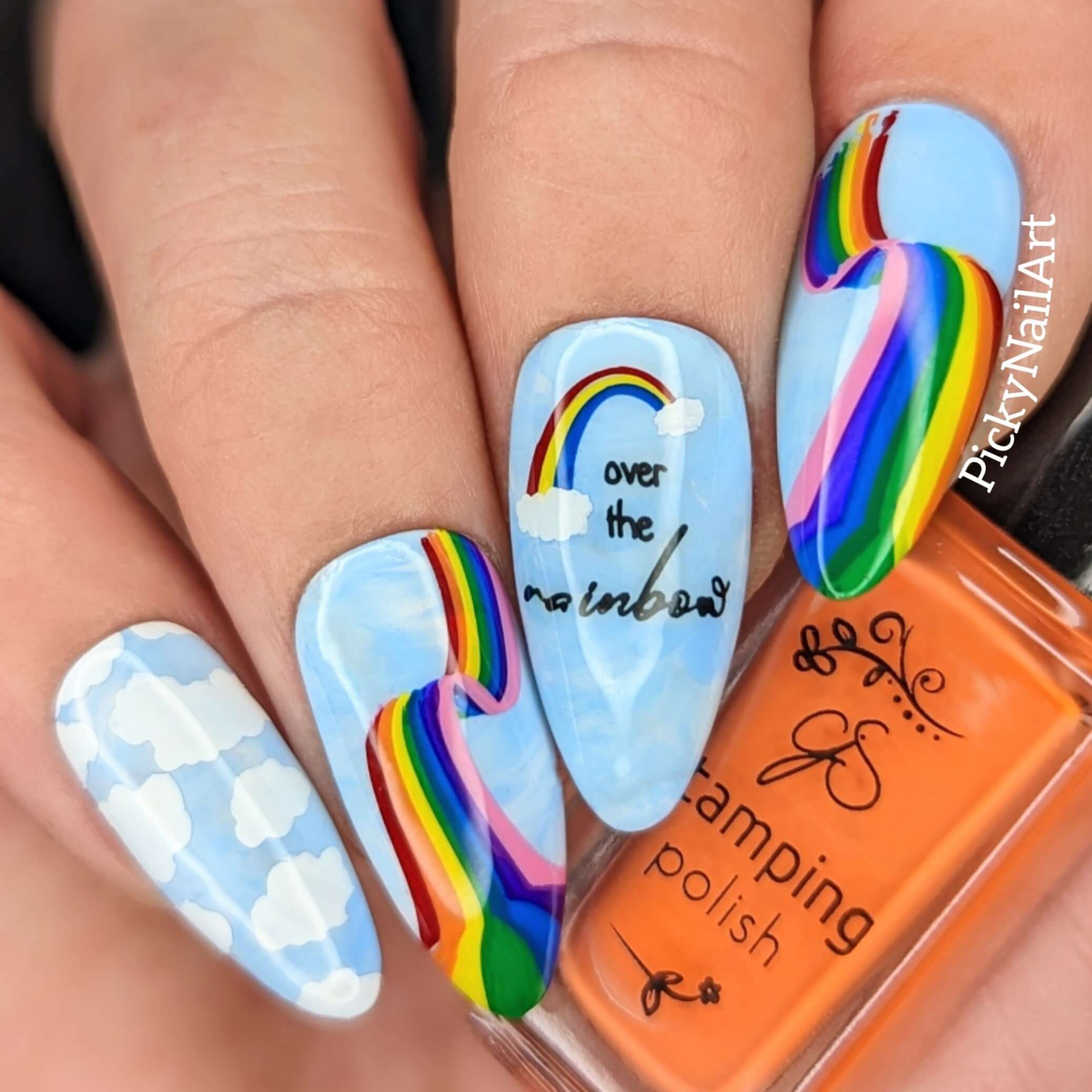 bright-manicure-showing-nail-art-designs-of-rainbows-and-clouds-over-the-rainbow