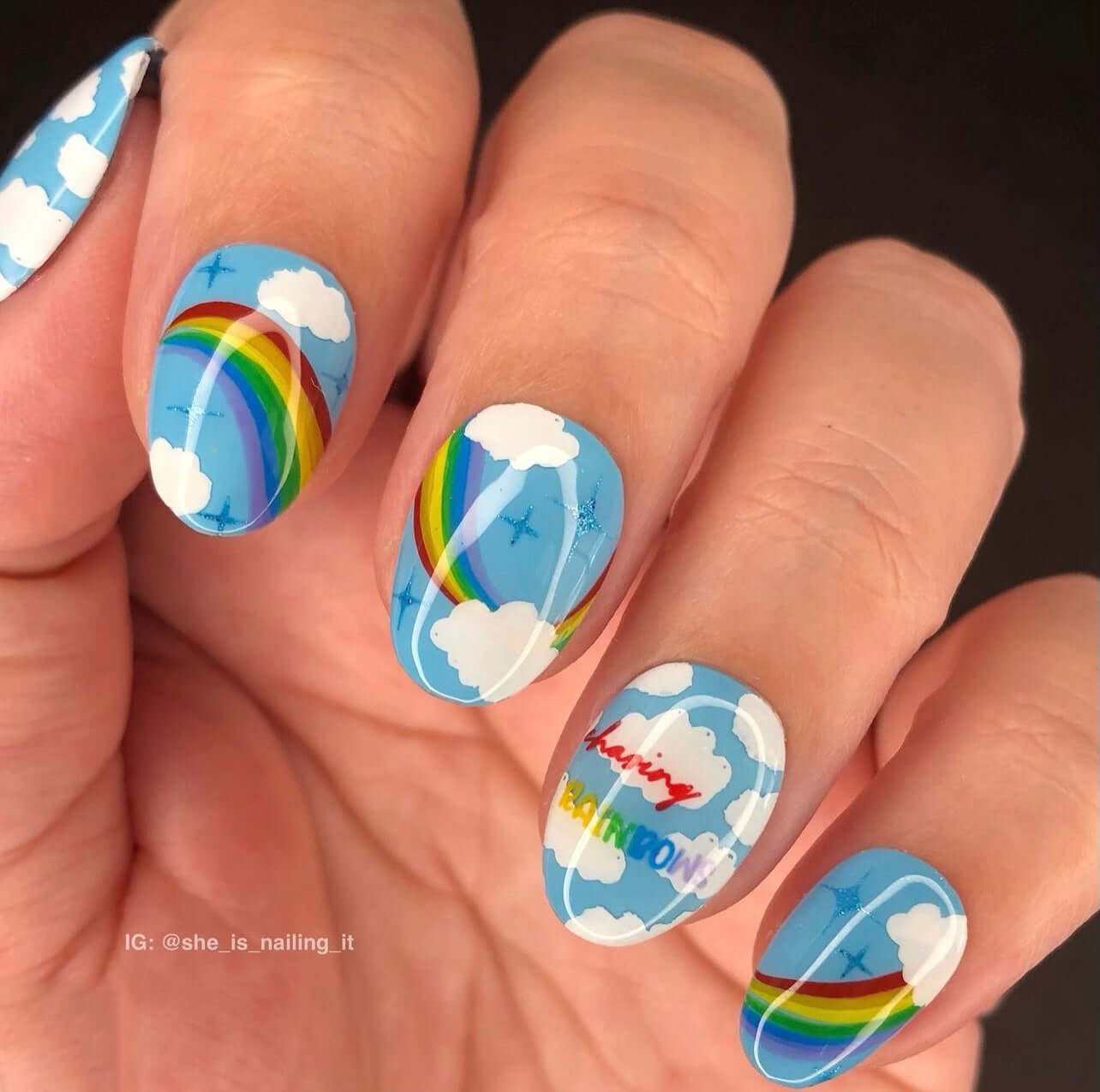 beautiful-manicure-showing-nail-art-designs-of-rainbows-and-clouds