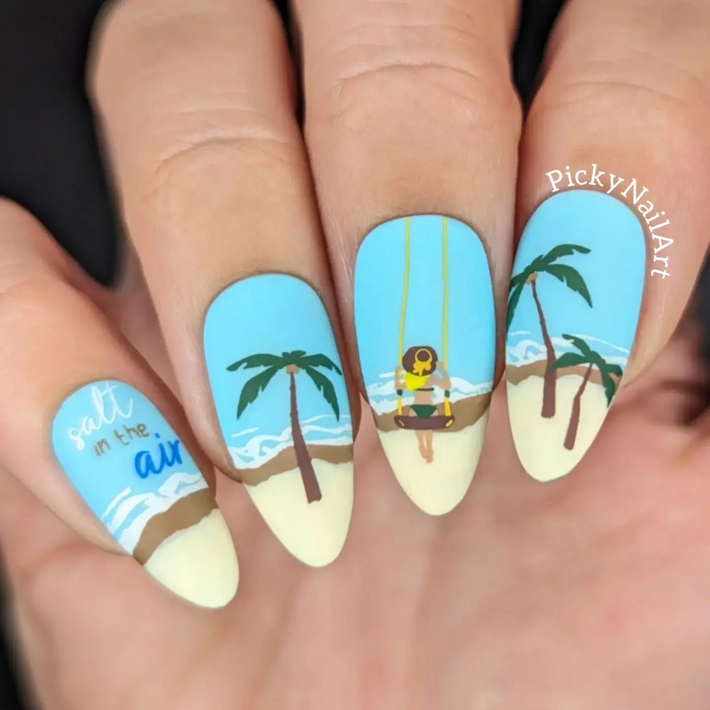 beautiful-manicure-with-a-nail-art-design-of-a-beach-scene-palm-trees-girl-on-a-swing