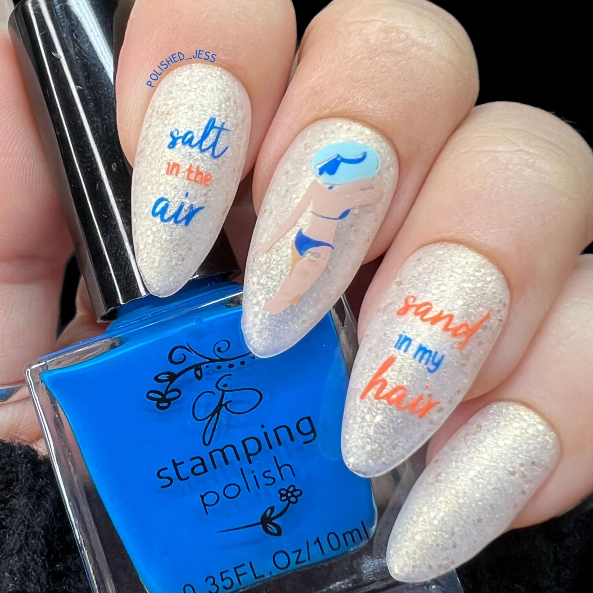 shimmering-manicure-with-a-nail-art-design-of-a-women-in-a-bikini-and-words-sand-in-my-hair-salt-in-the-air