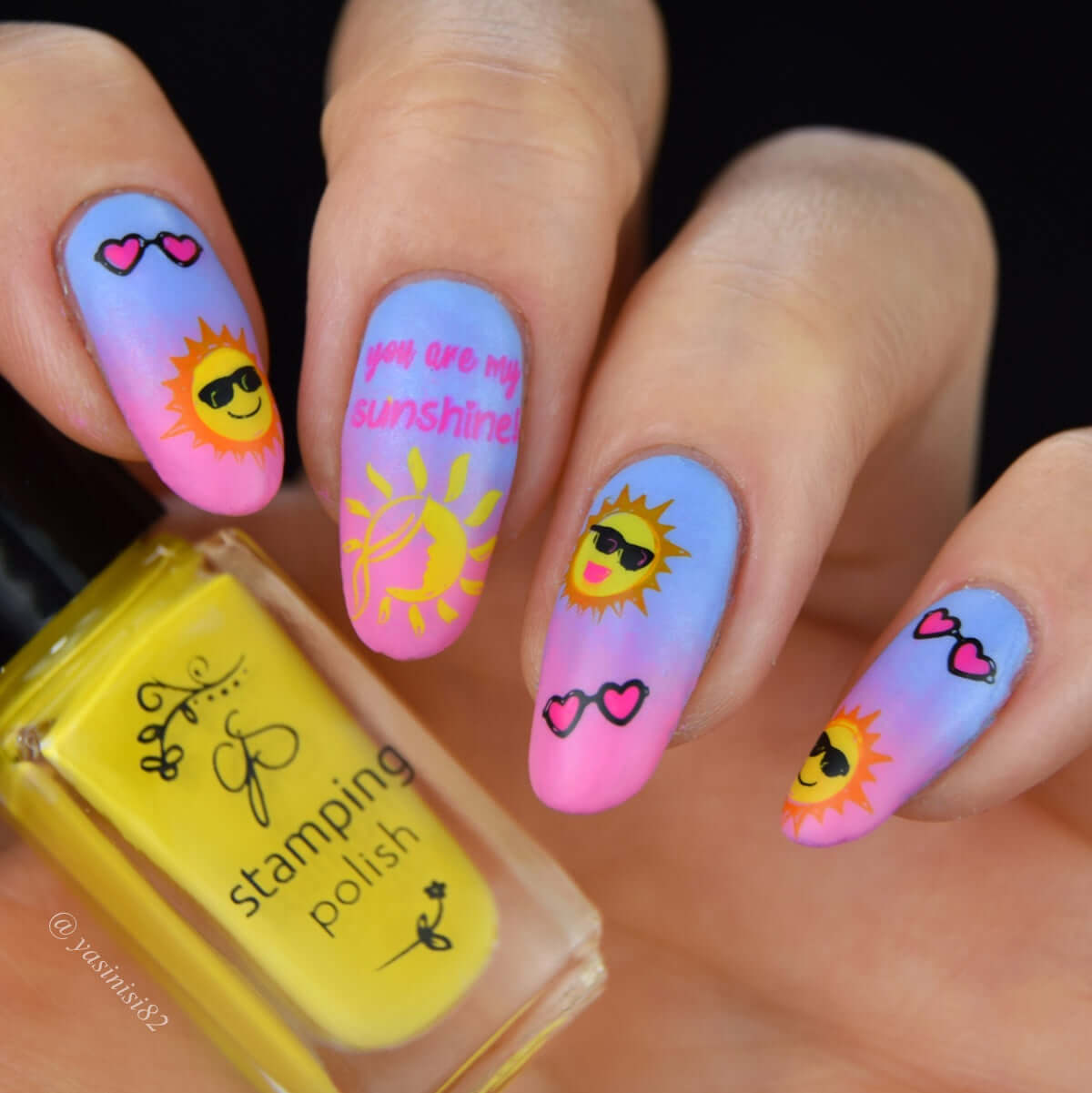 bright-manicure-showing-nail-art-designs-of-smiling-sunshines-and-the-words-you-are-my-sunshine