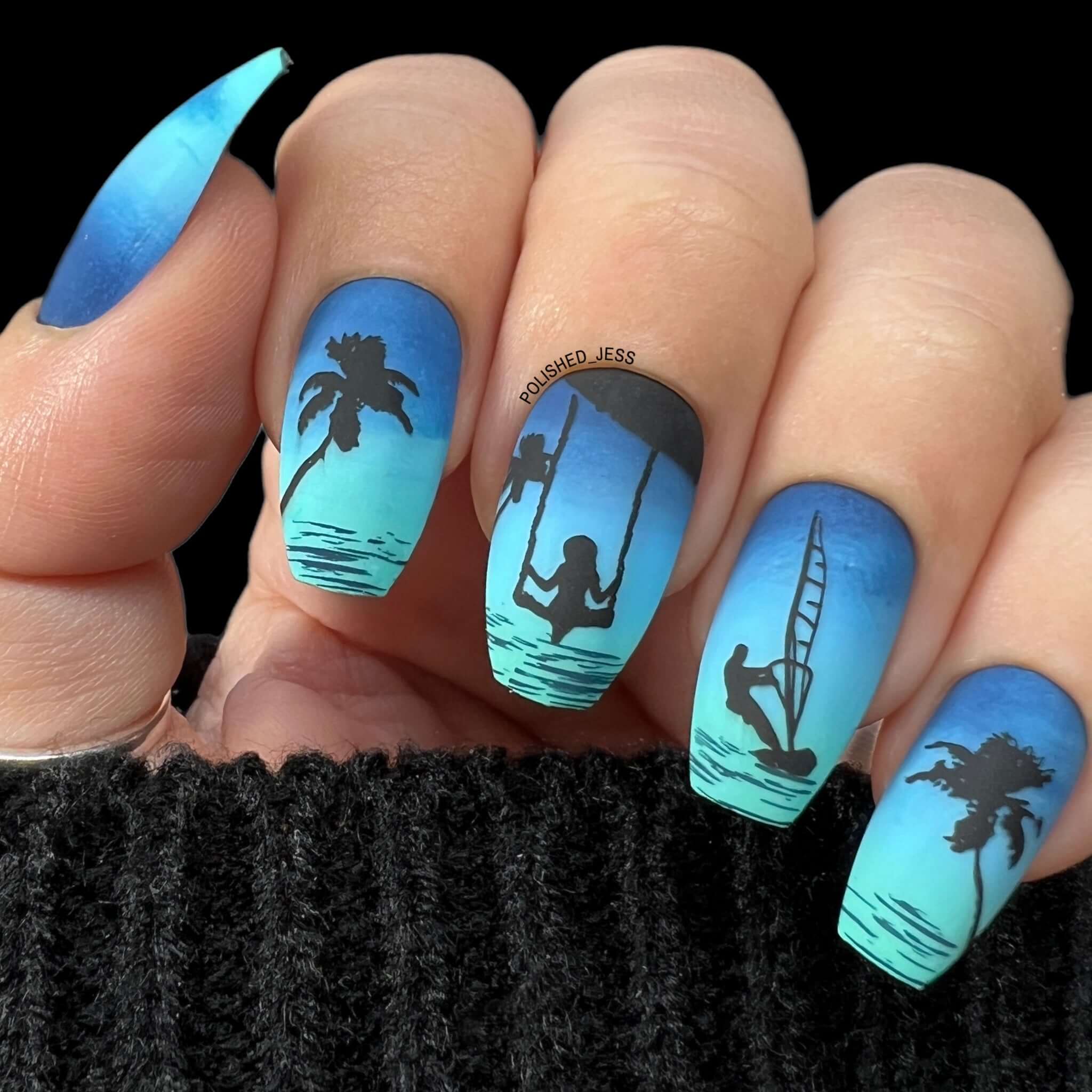 manicure-showing-nail-art-designs-of-summer-silhouettes-palm-trees-and-a-surfer