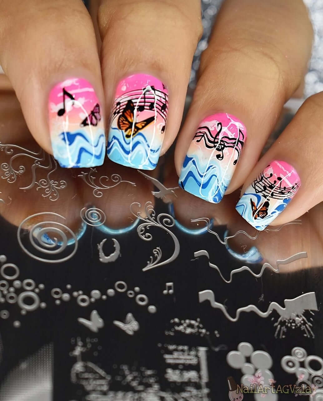 beautiful-manicure-showing-abstract-nail-art-designs-of-waves-musical-notes-and-butteflies