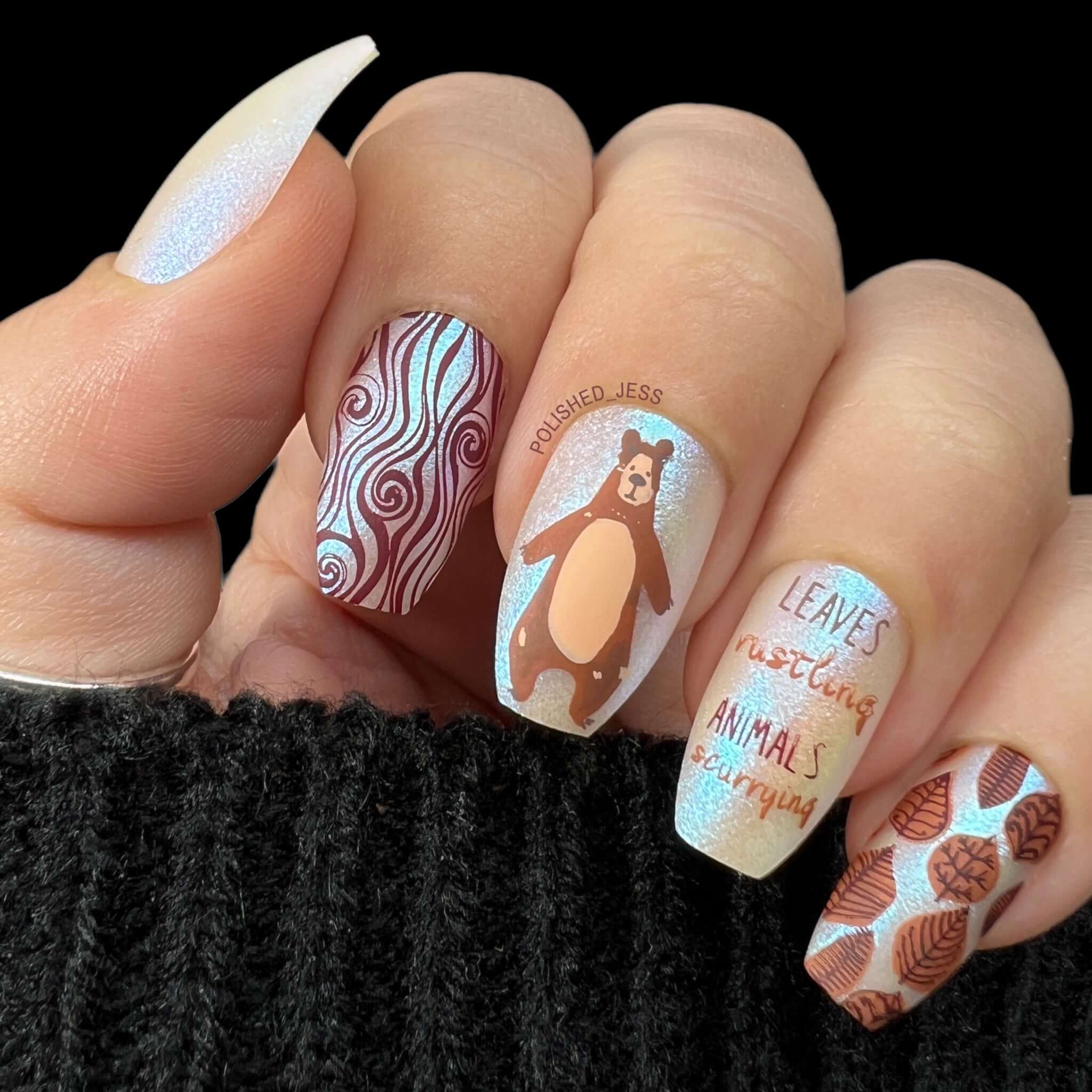 beautiful-shimmery-manicure-with-nail-art-designs-of-a-bear-leaves-and-the-words-leaves-rustling-animals-scurrying