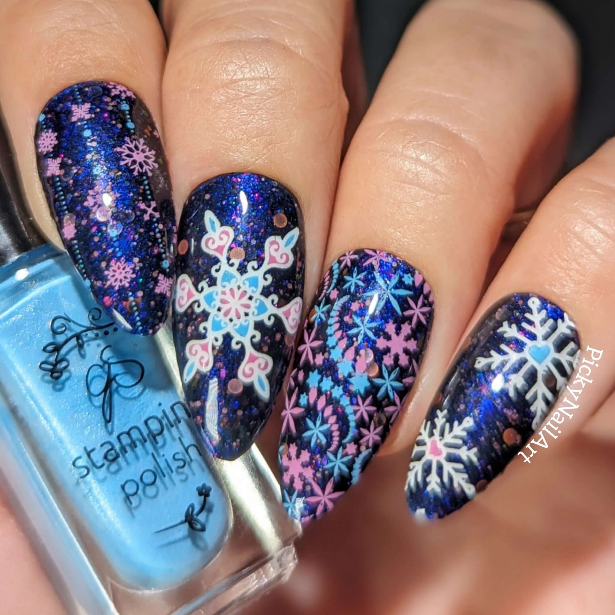 bright-manicure-showing-full-coverage-nail-art-designs-of-snowflakes