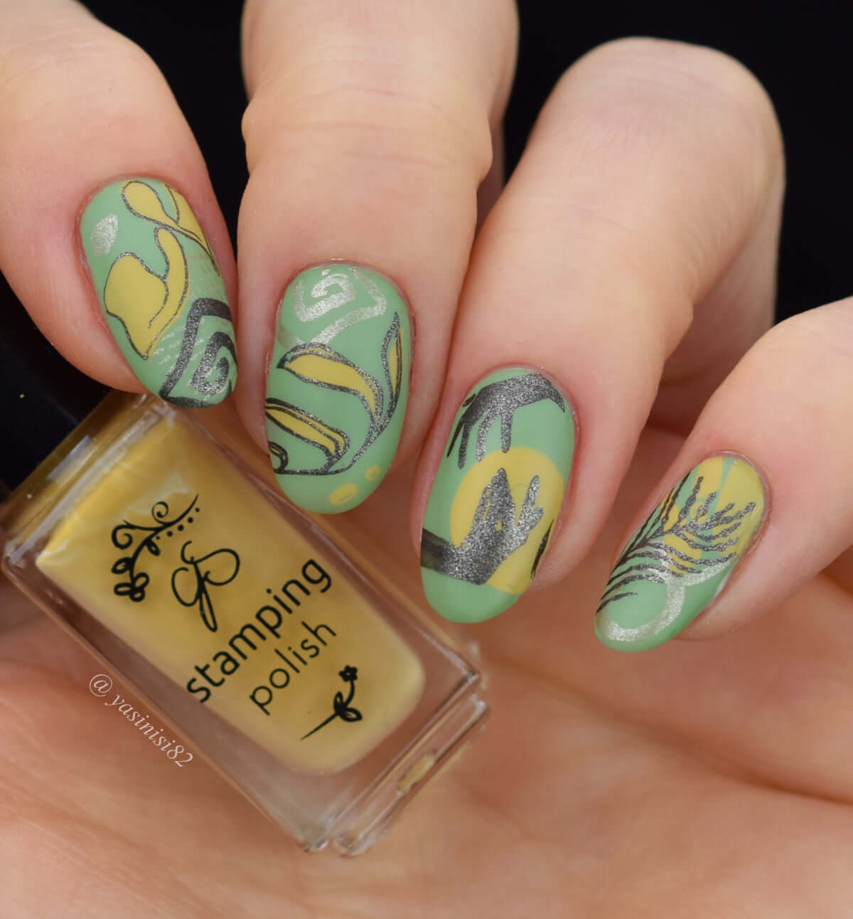 Manicure-showing-nail-art-designs-of-modern-boho-shapes-and-leaves-and-hands