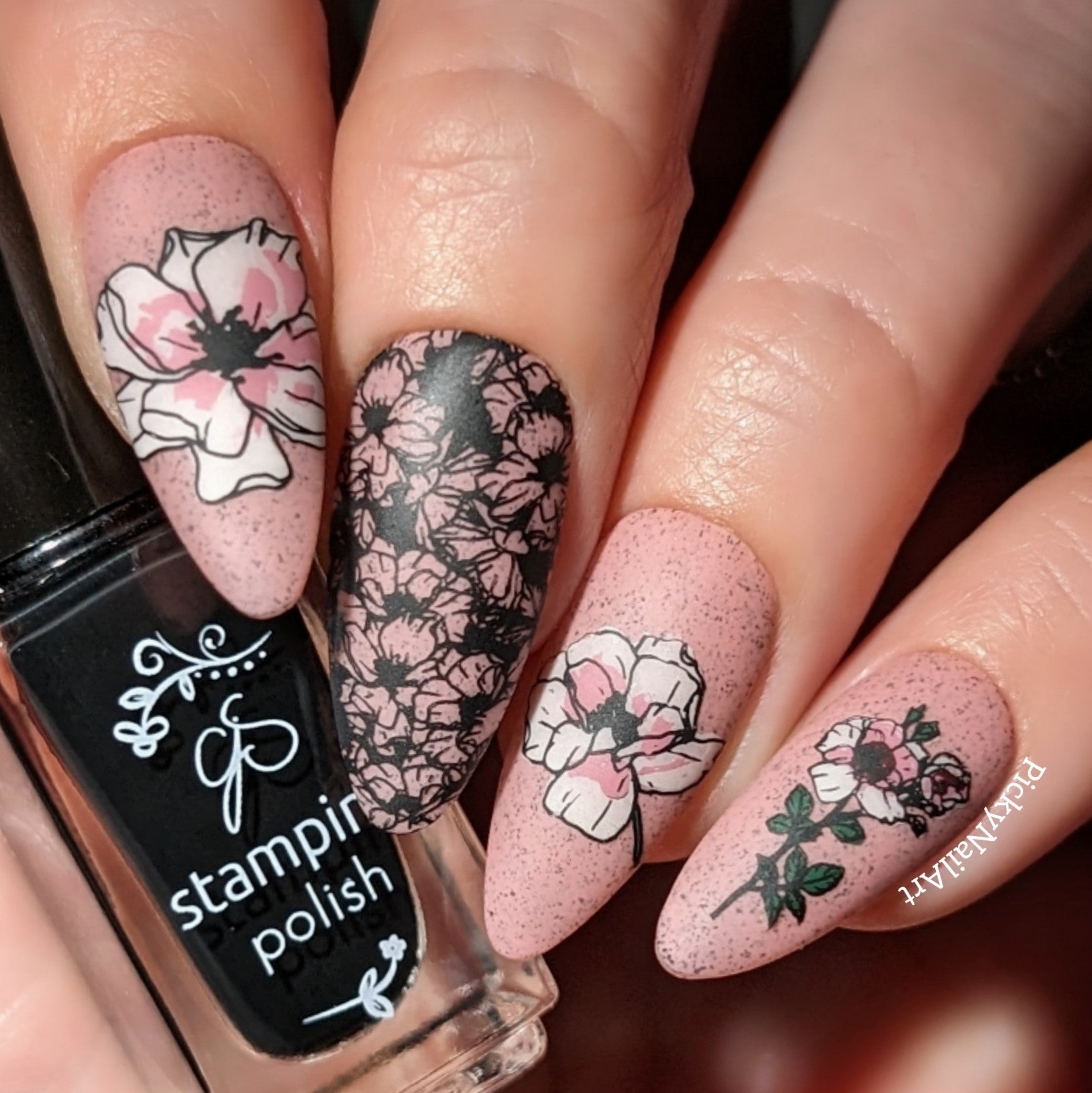 stunning-pale-pink-manicure-showing-floral-nail-art-designs