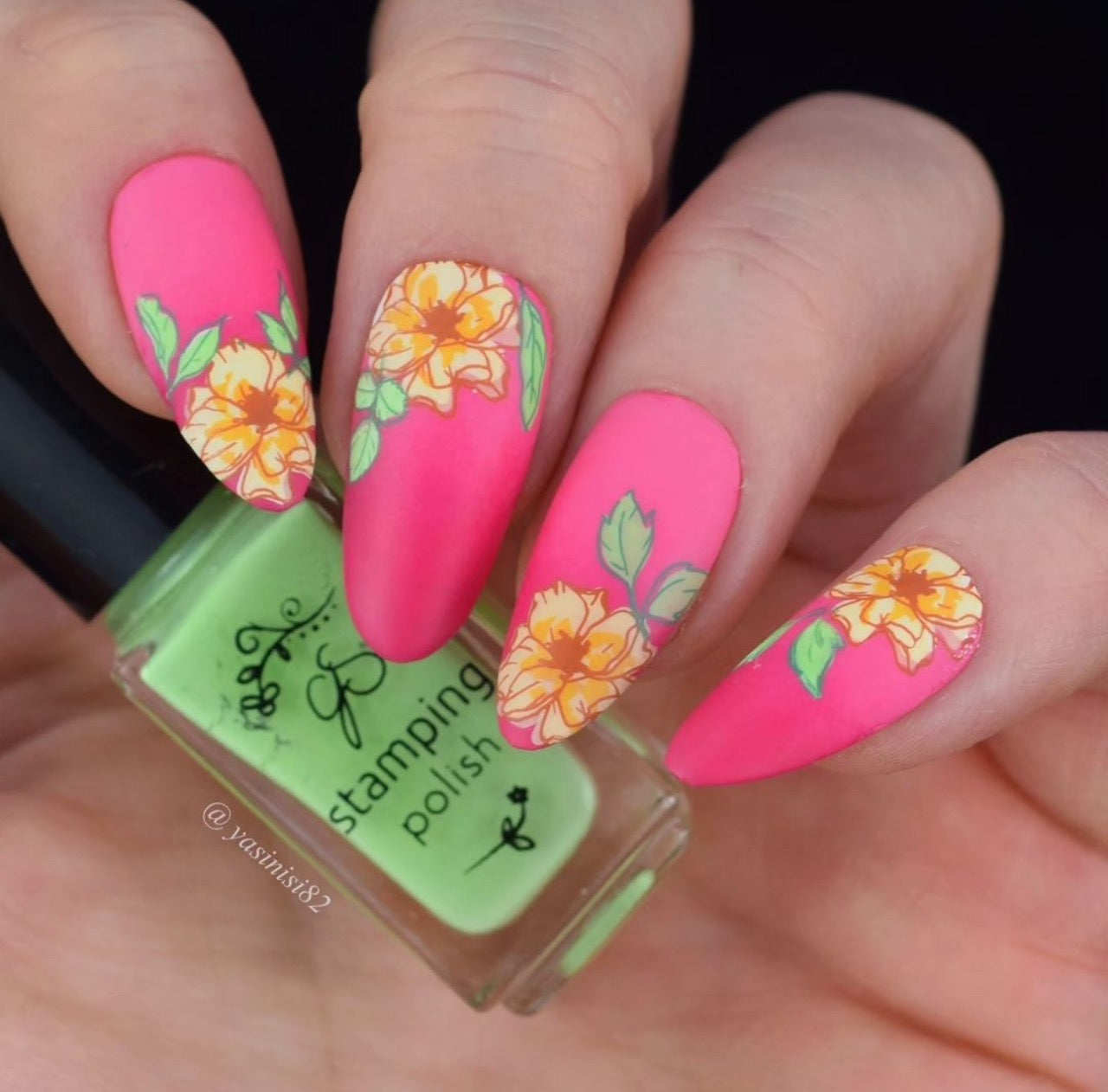 Bright-hot-pink-manicure-showing-nail-art-designs-of-flowers