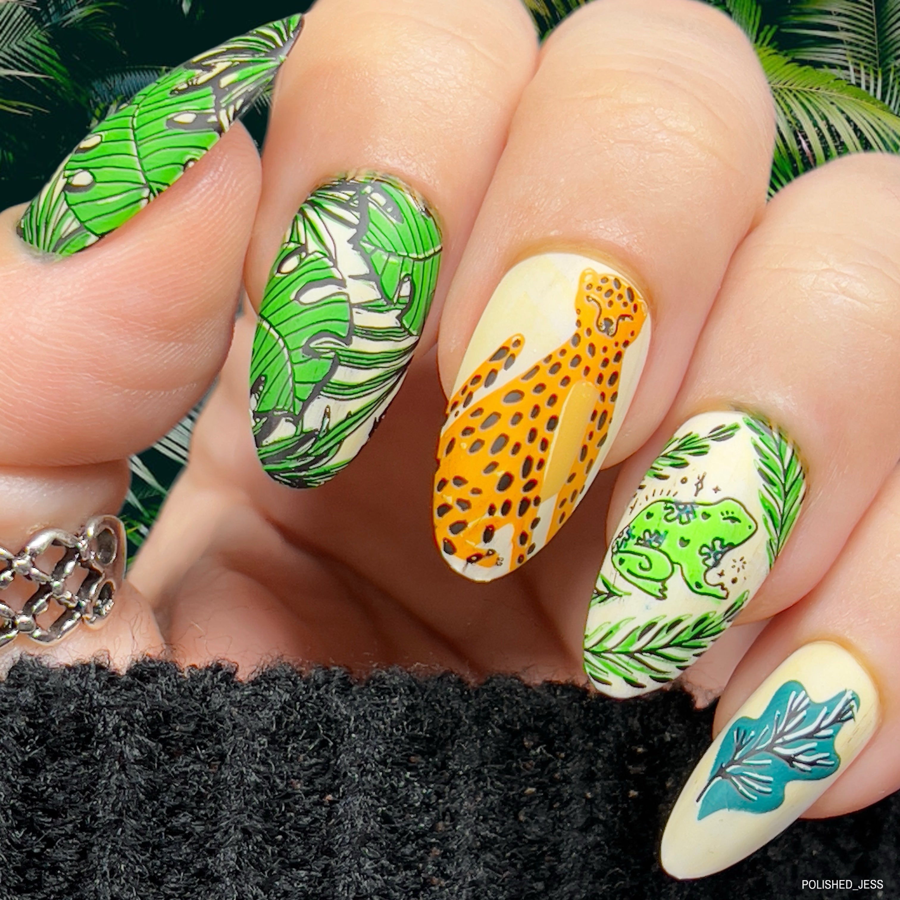 Viberant-manicure-showing-nail-art-designs-of-palm-leaves-a-cheetah-and-a-tropical-frog