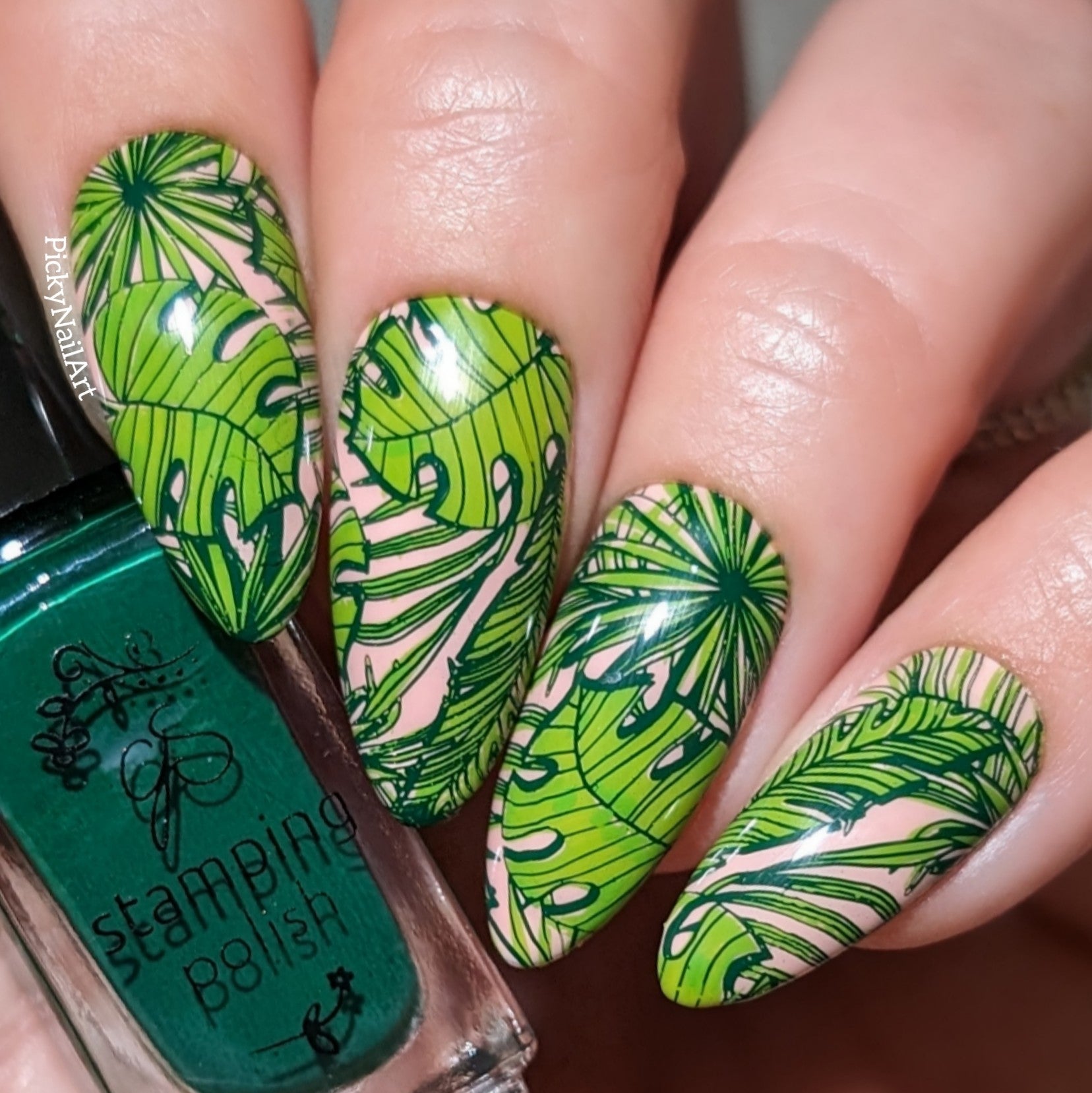 Manicure-showing-full-coverage-nail-art-designs-of-bright-green-palm-leaves