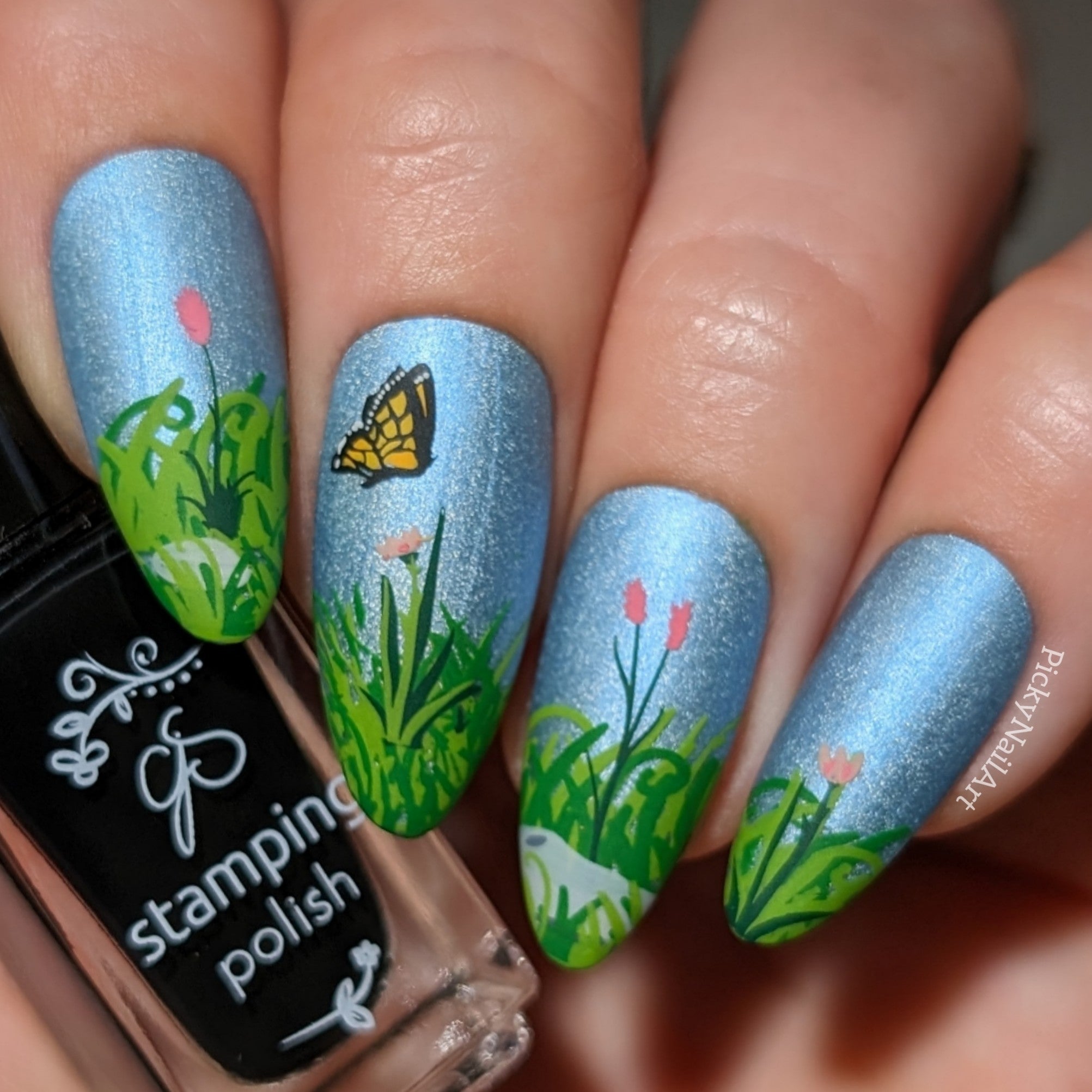 shimmery-manicure-showing-nail-art-designs-of-grass-flowers-and-a-butterfly