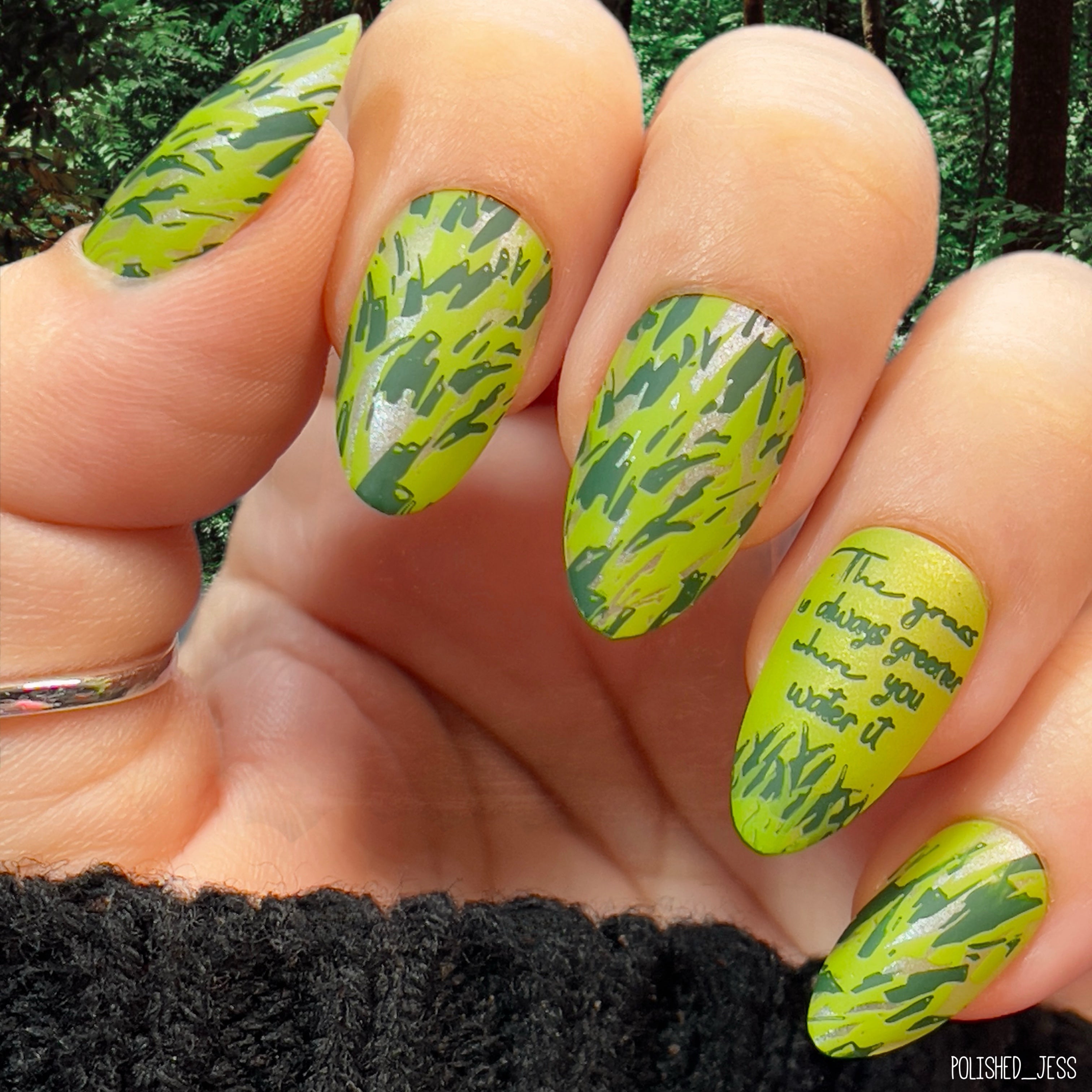 Manicure-showing-layered-nail-art-designs-of-green-grass-with -words-the-grass-is-always-greener-where-you-water-it