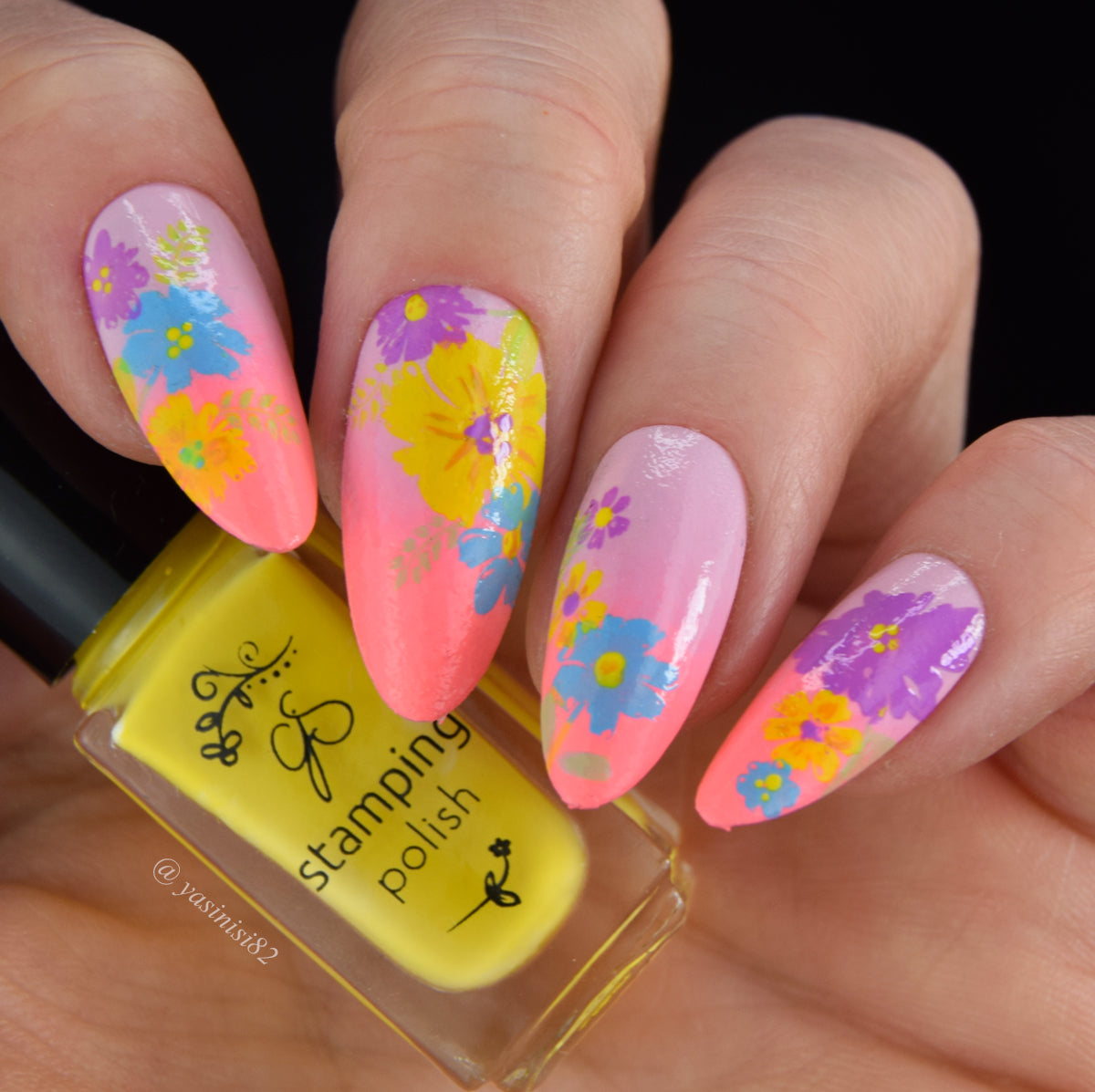 Bright-pink-manicure-with-nail-art-designs-of-blue-yellow-and-purple-flowers