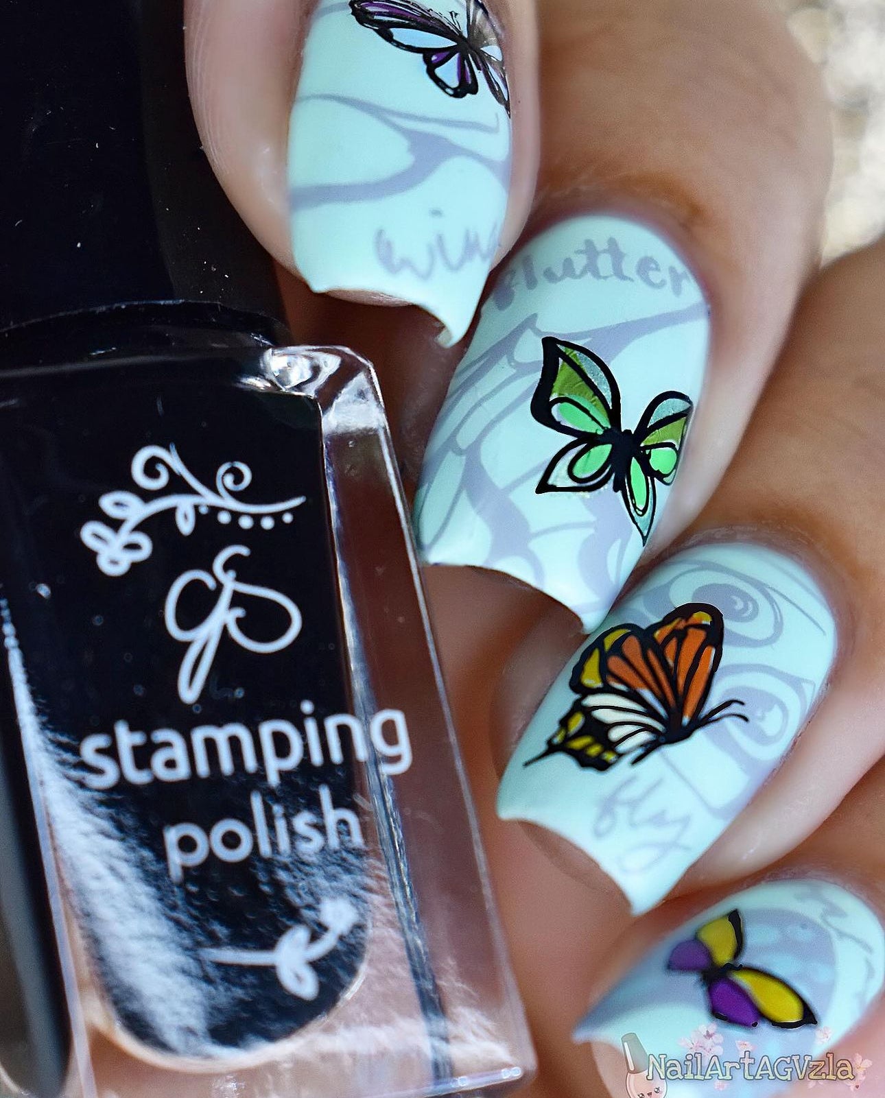 beautiful-manicure-showing-nail-art-designs-of-butterflies-with-a-black-polish