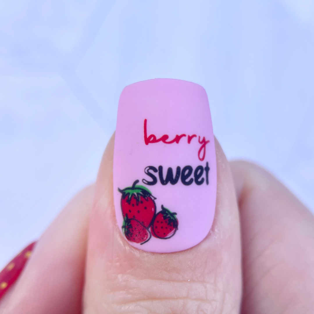 Single-manucire-nail-showing-nail-art-designs-of-a-cute-bunch-of-strawberries-with the words-berry-sweet