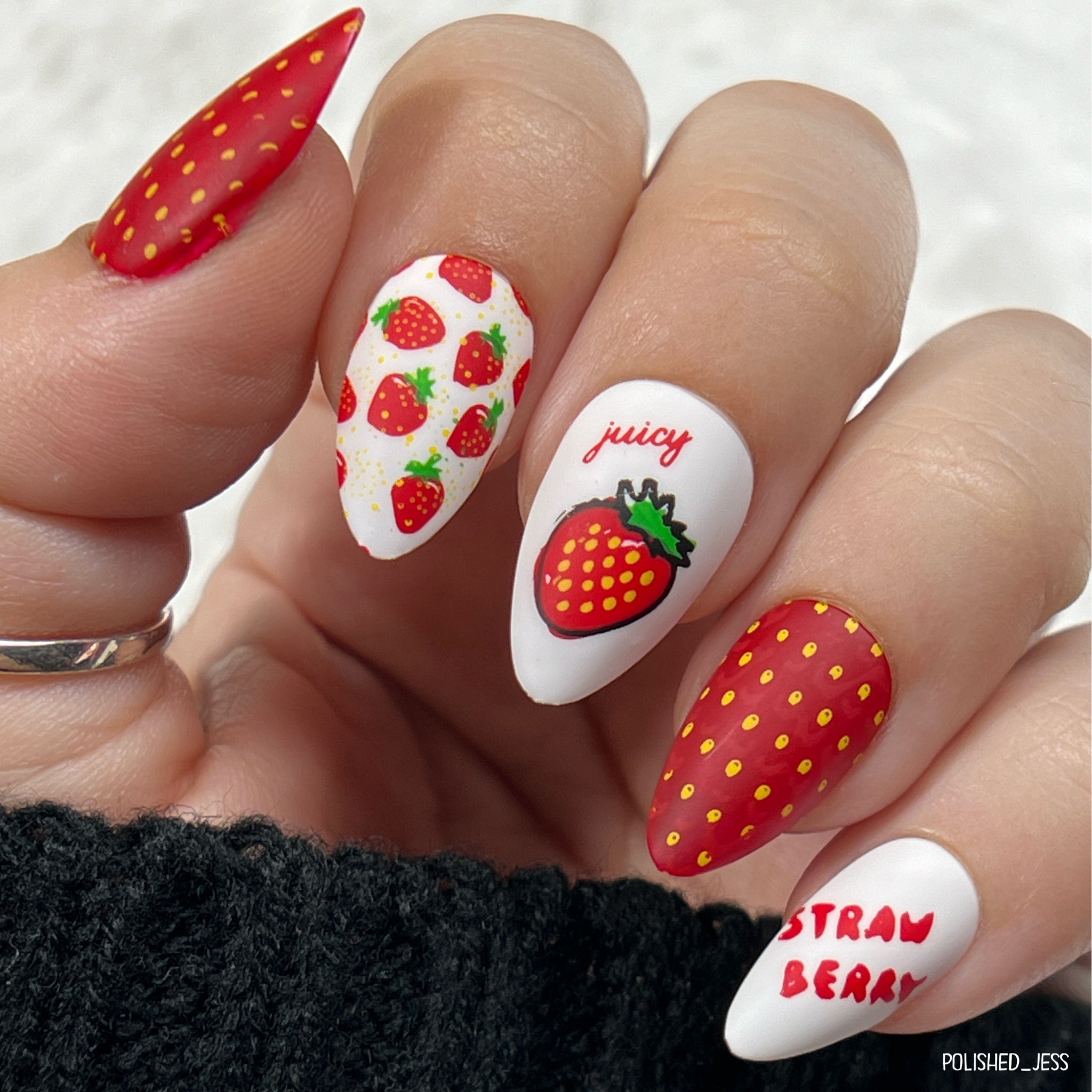 Bright-red-and-white-manicure-showing-strawberries-strawberry-flesh-and-the-words-juicy