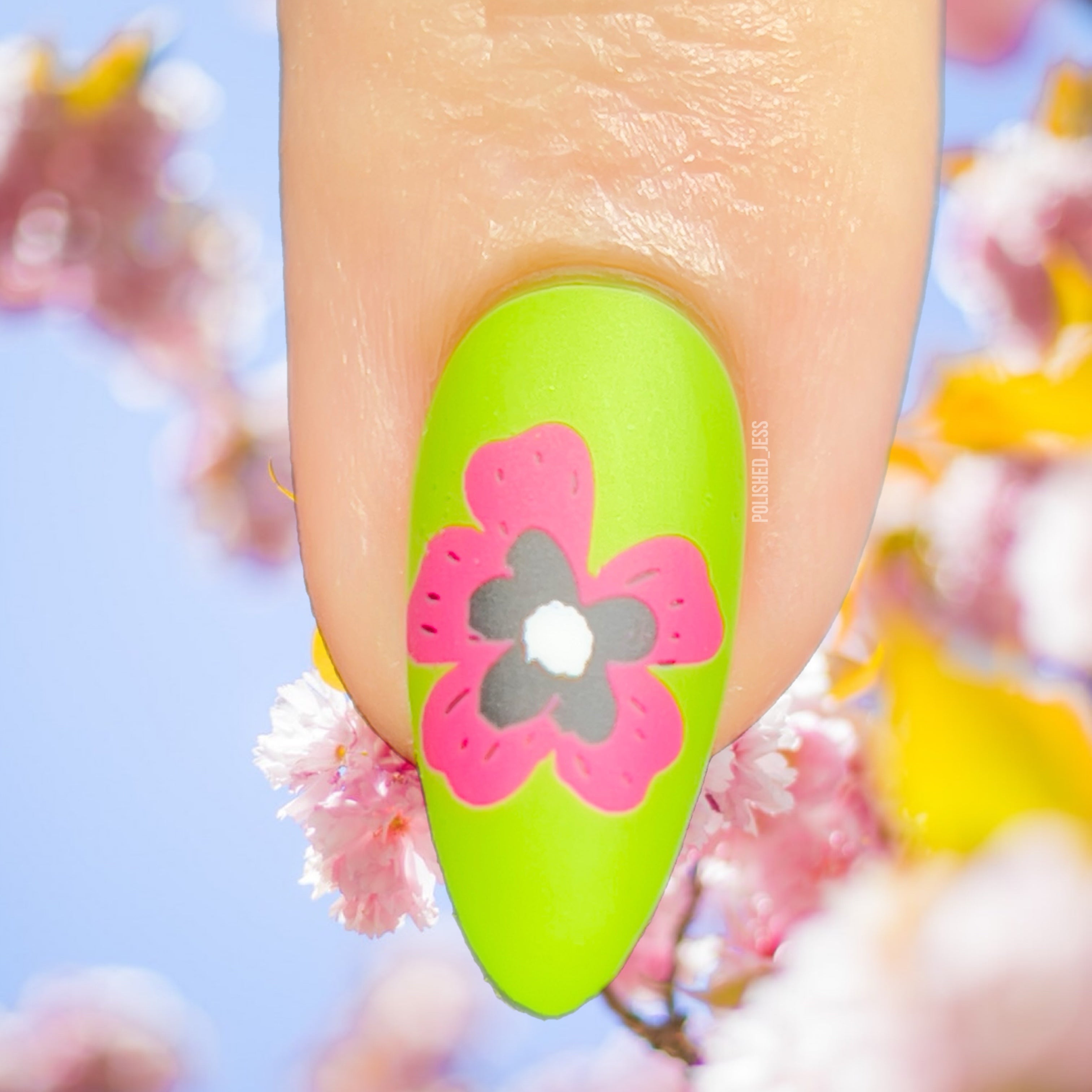 single-manicured-nail-showing-bright-nail-art-design-of-modern-pink-flower-head