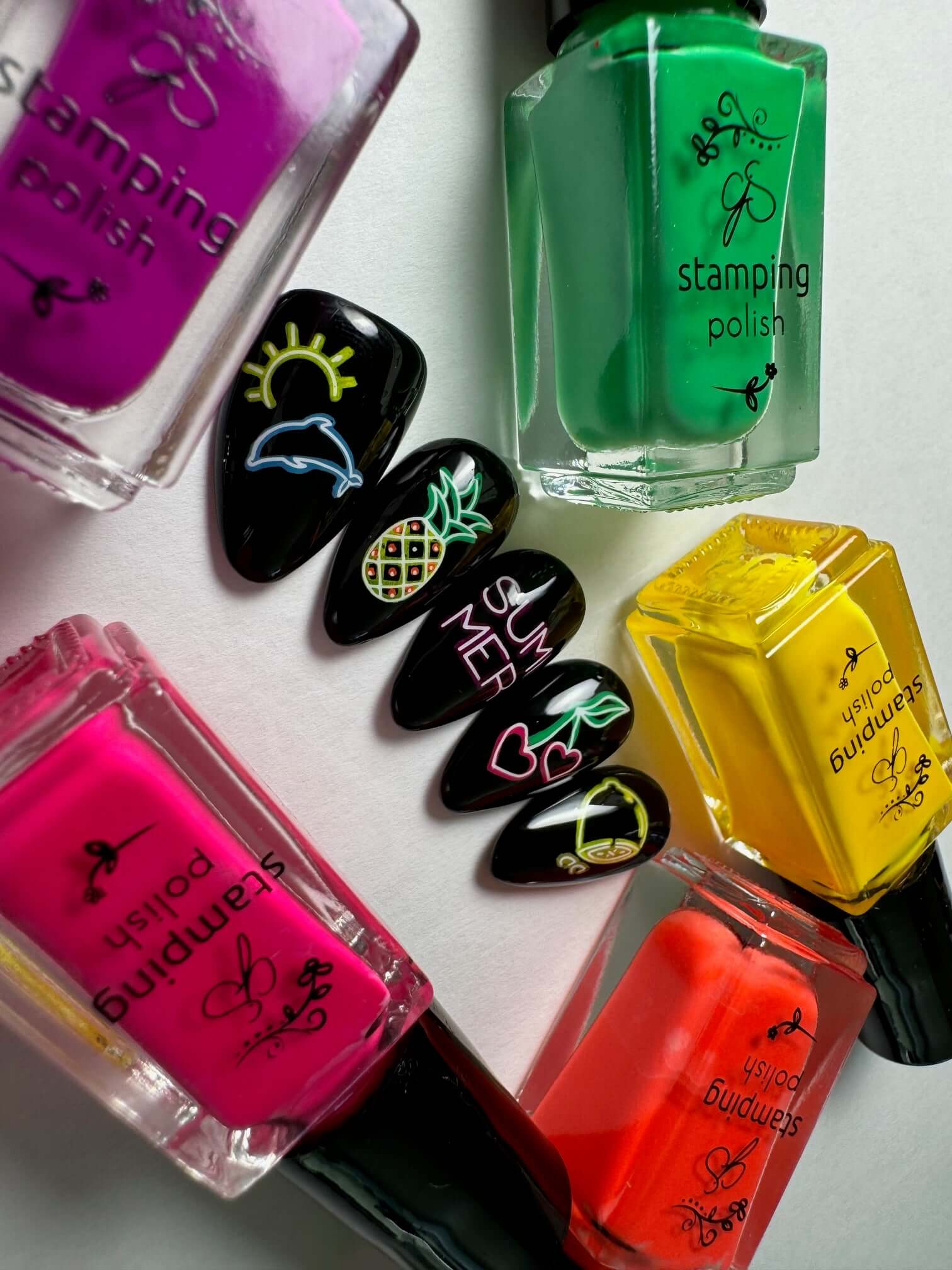 manicure-of-layered-nail-art-designs-showcasing-word-summer-dolphin-pineapple-designs-and-neon-stamping-polishes