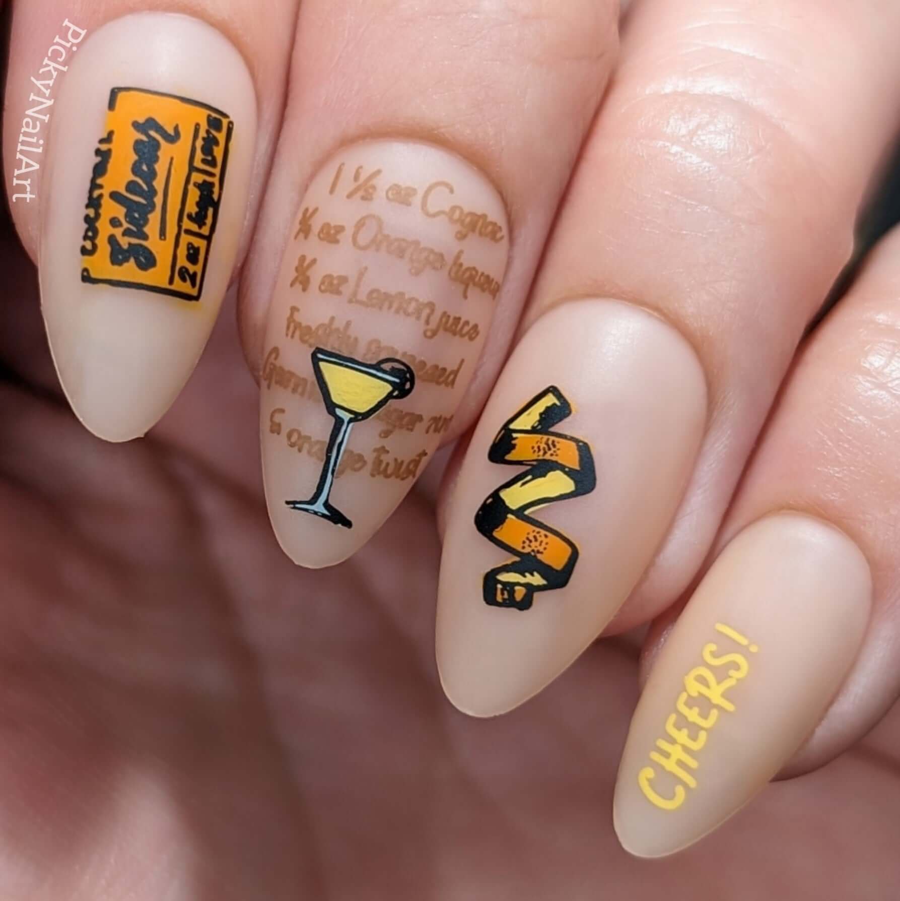 manicure-featuring-nail-art-with-a-lemon-peel-sidecar-cocktail-and-the-word-cheers