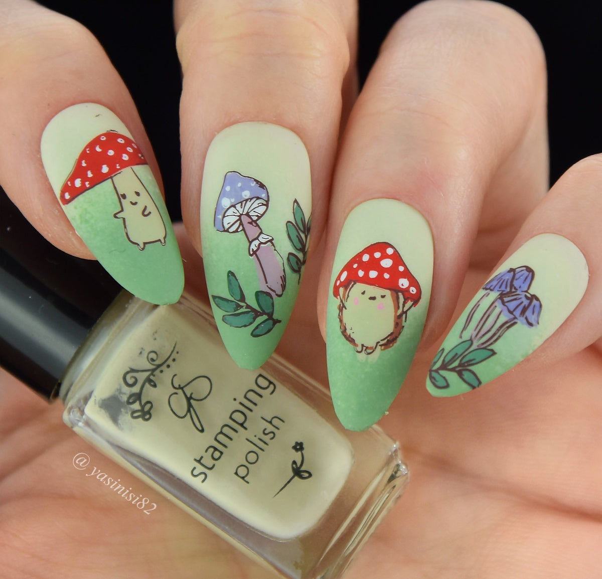 beautiful-manicure-with-red-and-white-mushrooms-and-green-leaves