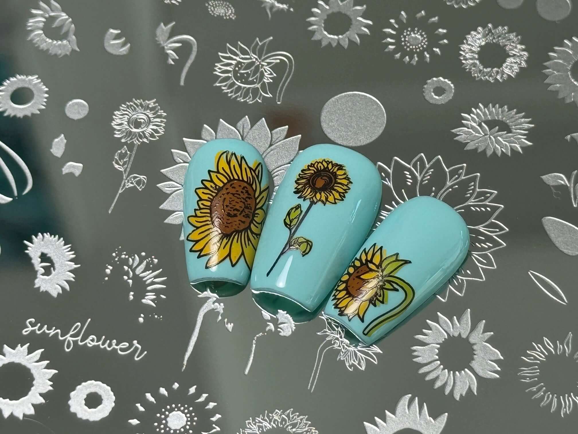 three-nail-tips-with-layered-nail-art-designs-of-sunflowers