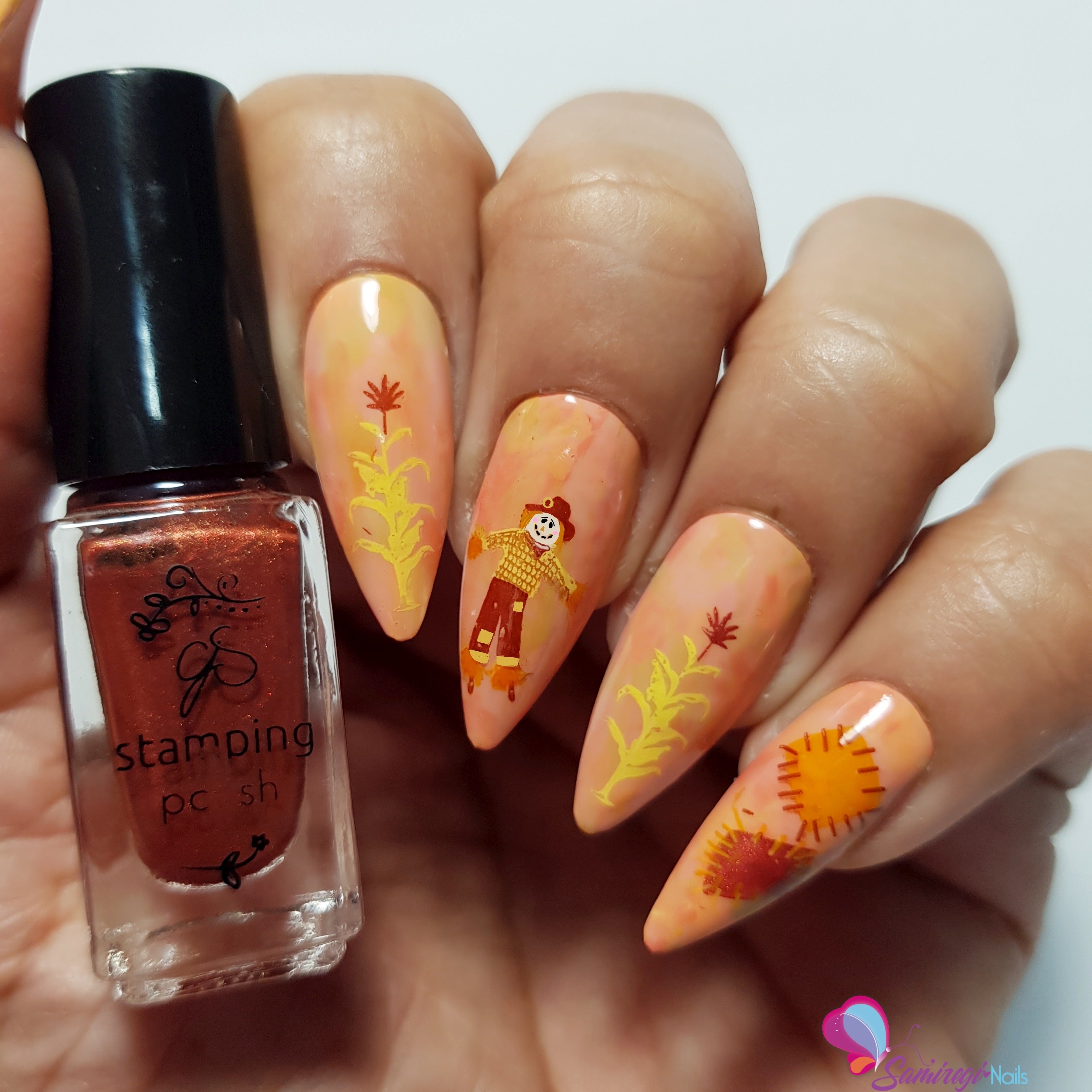 stunning-manicure-with-nail-art-designs-of-a-scarecrow-patches-and-wheat-stalks