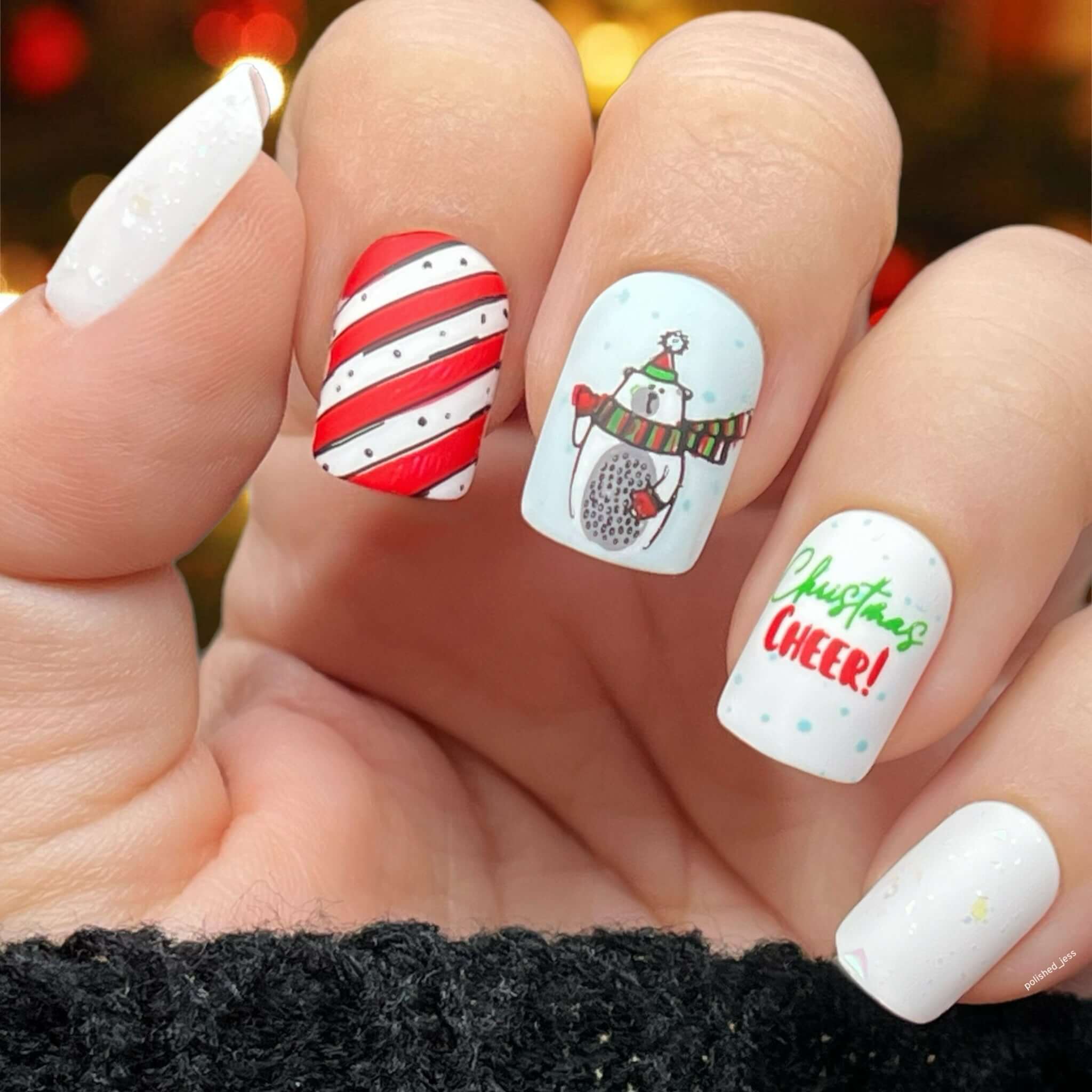 stunning-festive-manciure-with-a-nail-art-design-of-a-cute-polar-bear-and-the-words-christmas-cheer