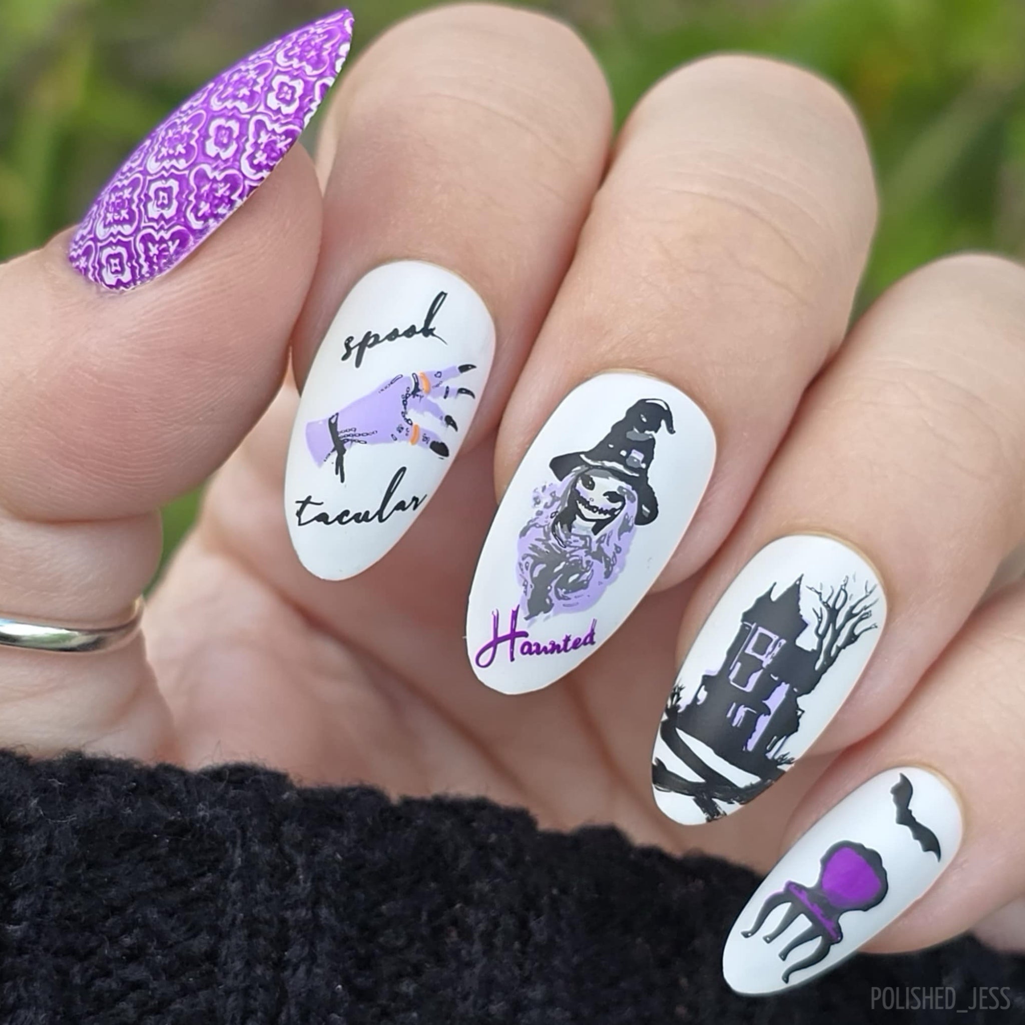 beautiful-manicure-with-Halloween-nail-art-designs-of-a-haunted-house-witch-and-spooky-hand