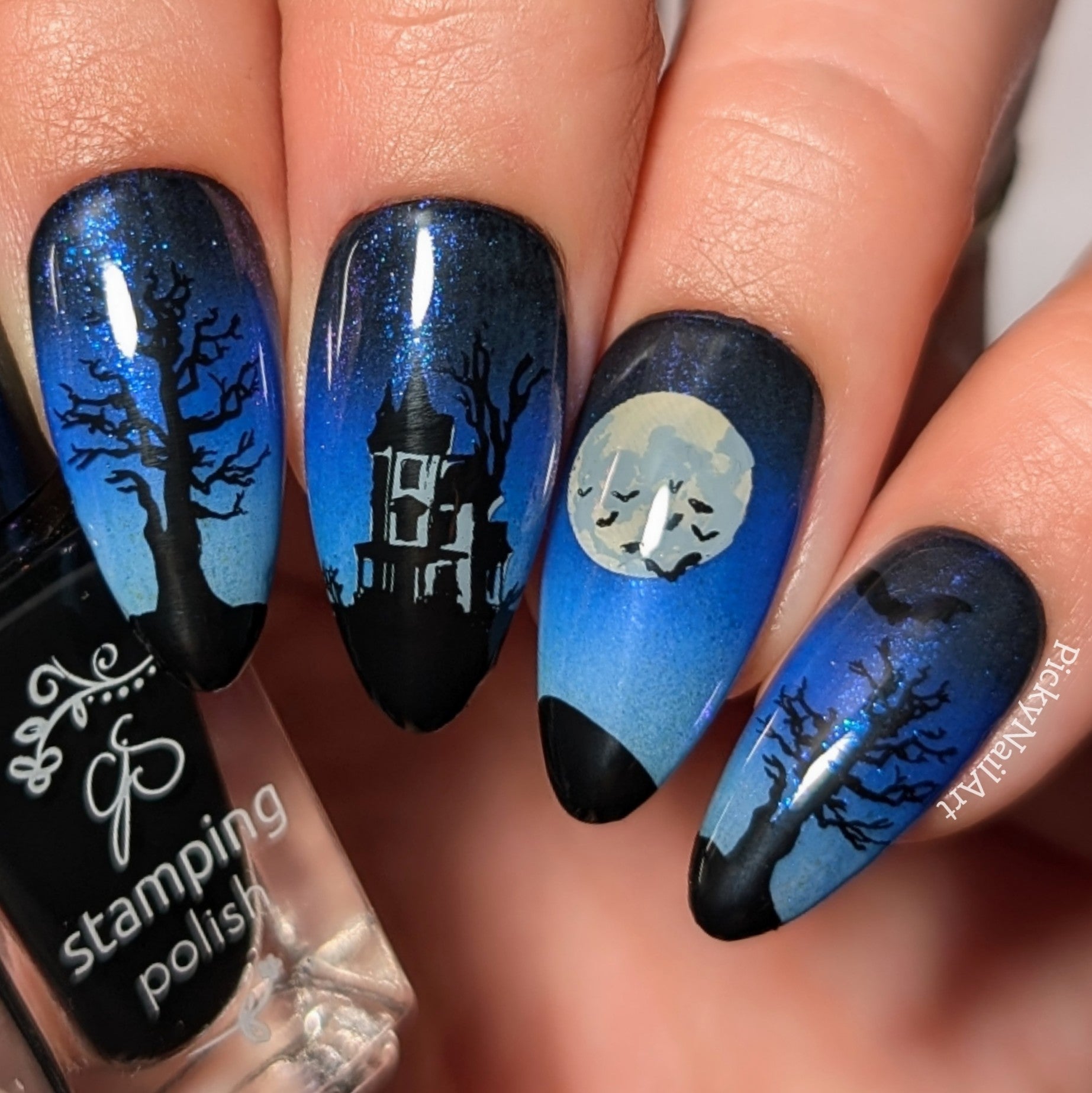 stunning-manicure-with-a-nail-art-halloween-scene-of-a-haunted-house-trees-bats-full-moon