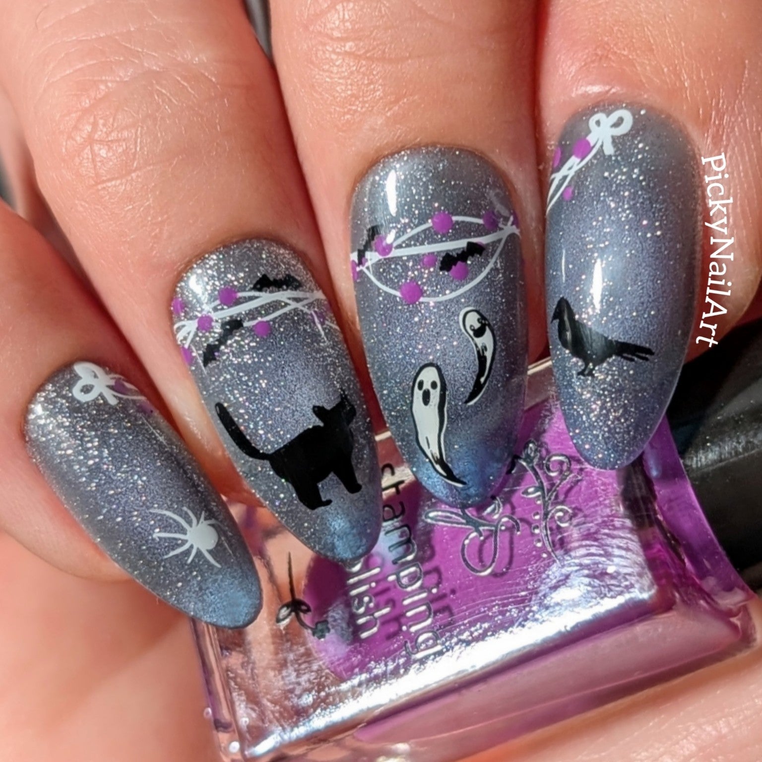 manicure-with-halloween-themed-nail-art-designs-of-bats-a-black-cat-and-ghosts