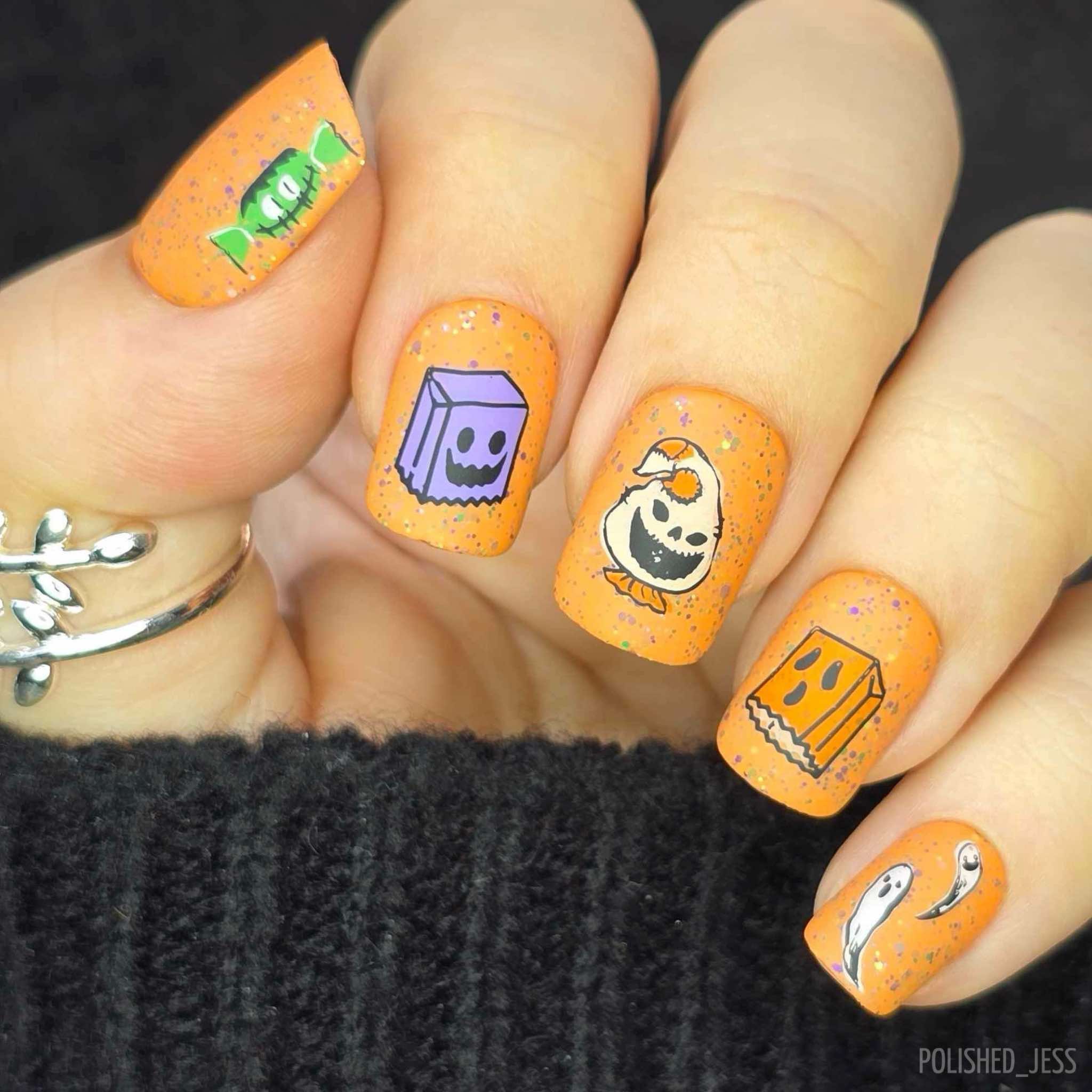 bright-manciure-with-cute-Halloween-nail-art-designs-of-scary-candy-bags