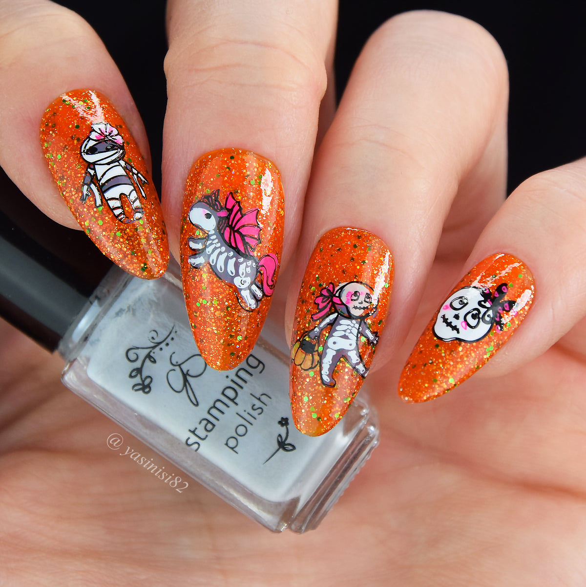 bright-manciure-with-halloween-nail-art-designs-of-cute-skeletons-and-a-mummy