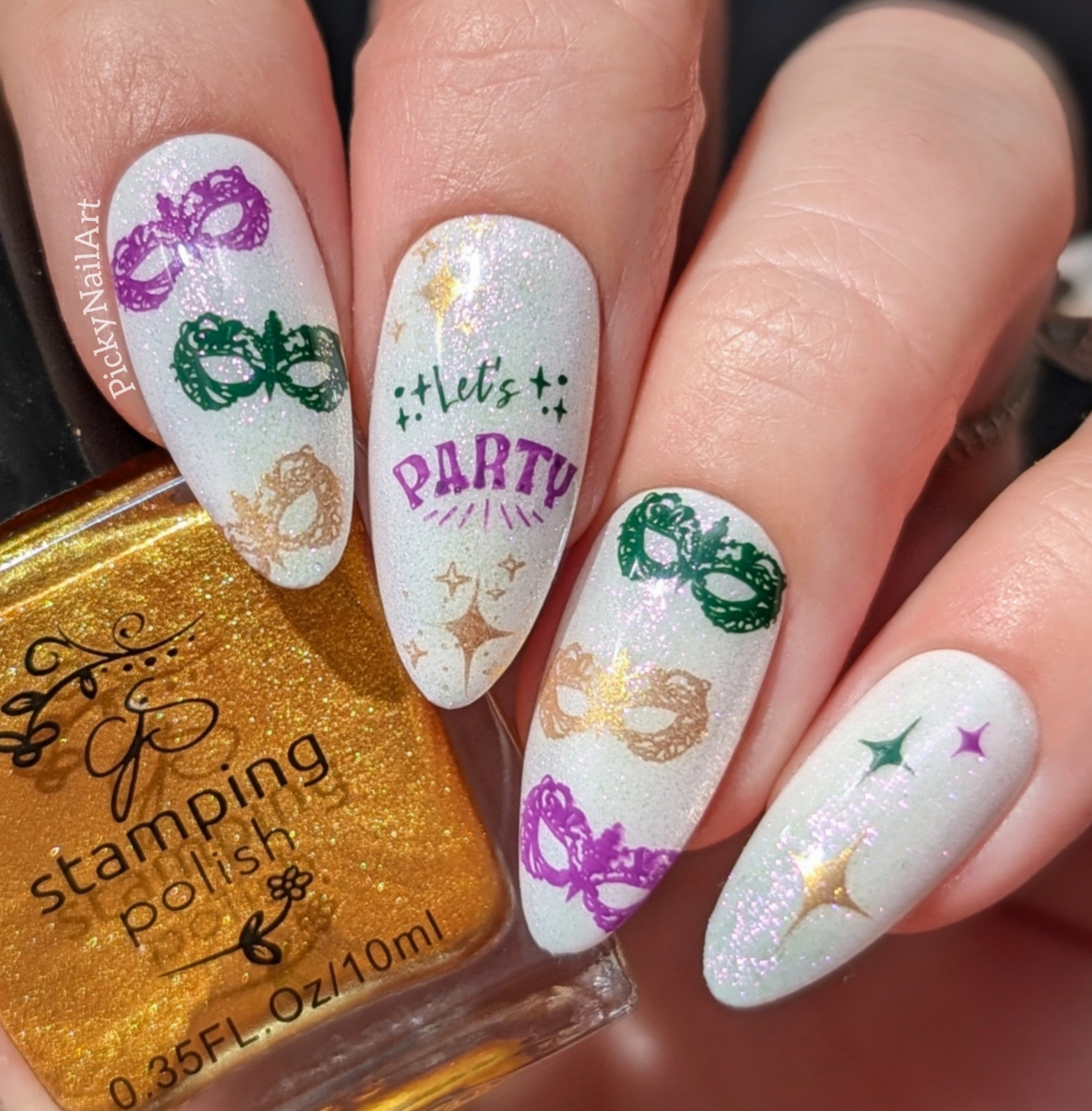 shimmery-manicure-with-nail-art-designs-of-charade-masks-and-the-words-let's-party