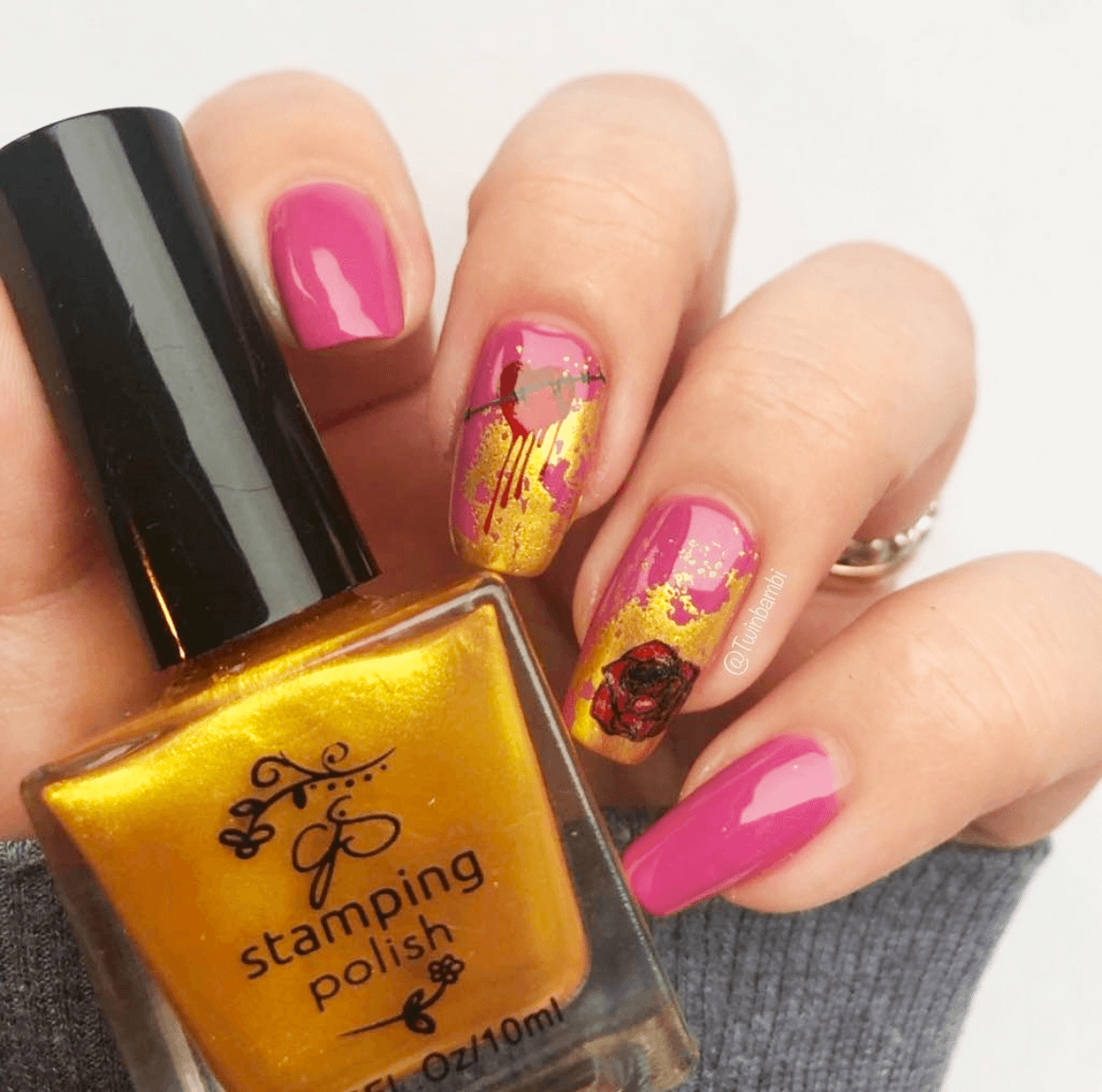 stunning-manicure-with-nail-art-designs-of-a-rose-and-heart-wrapped-in-barbwire