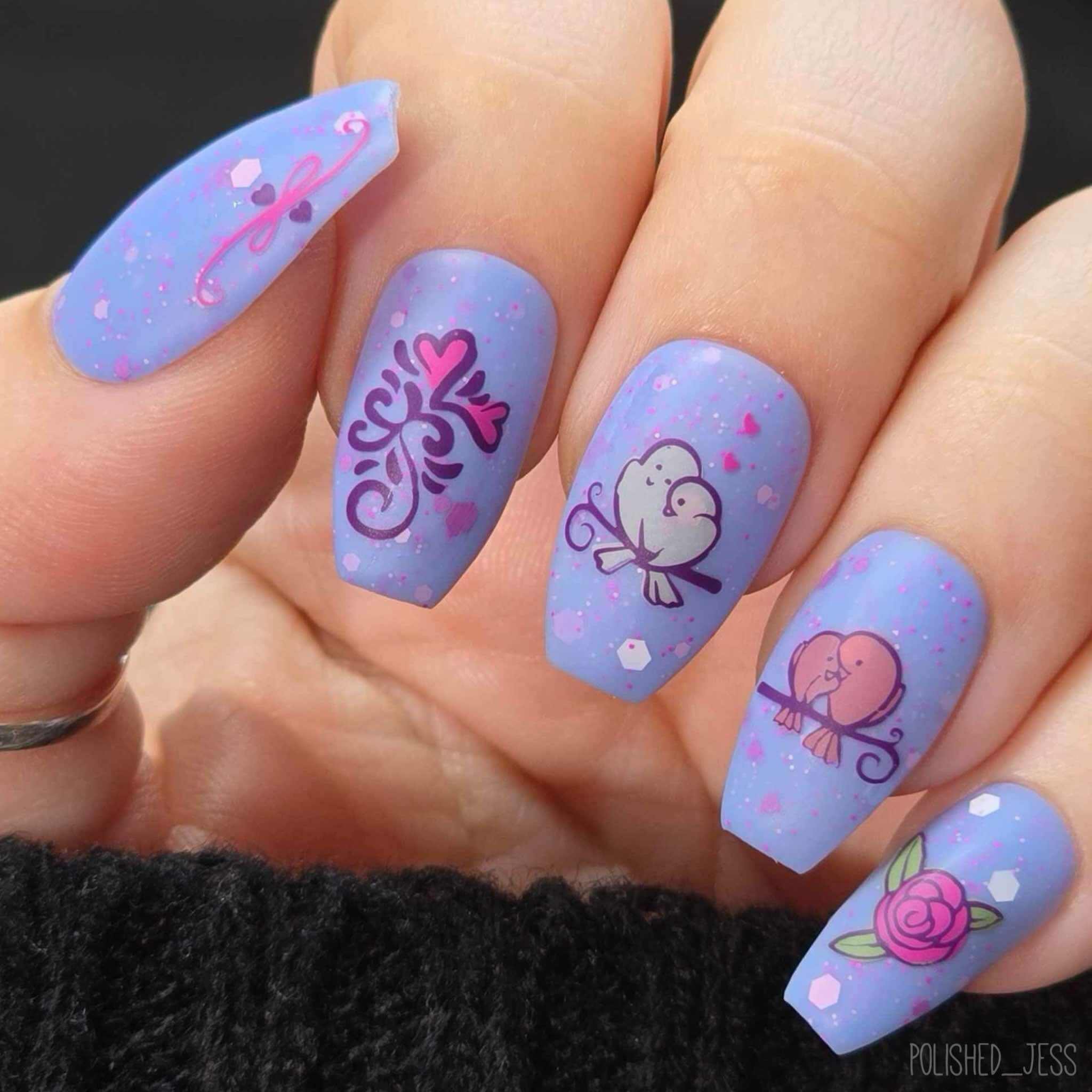 bright-manicure-showing-valentines-nail-art-designs-of-love-birds-and-swirls