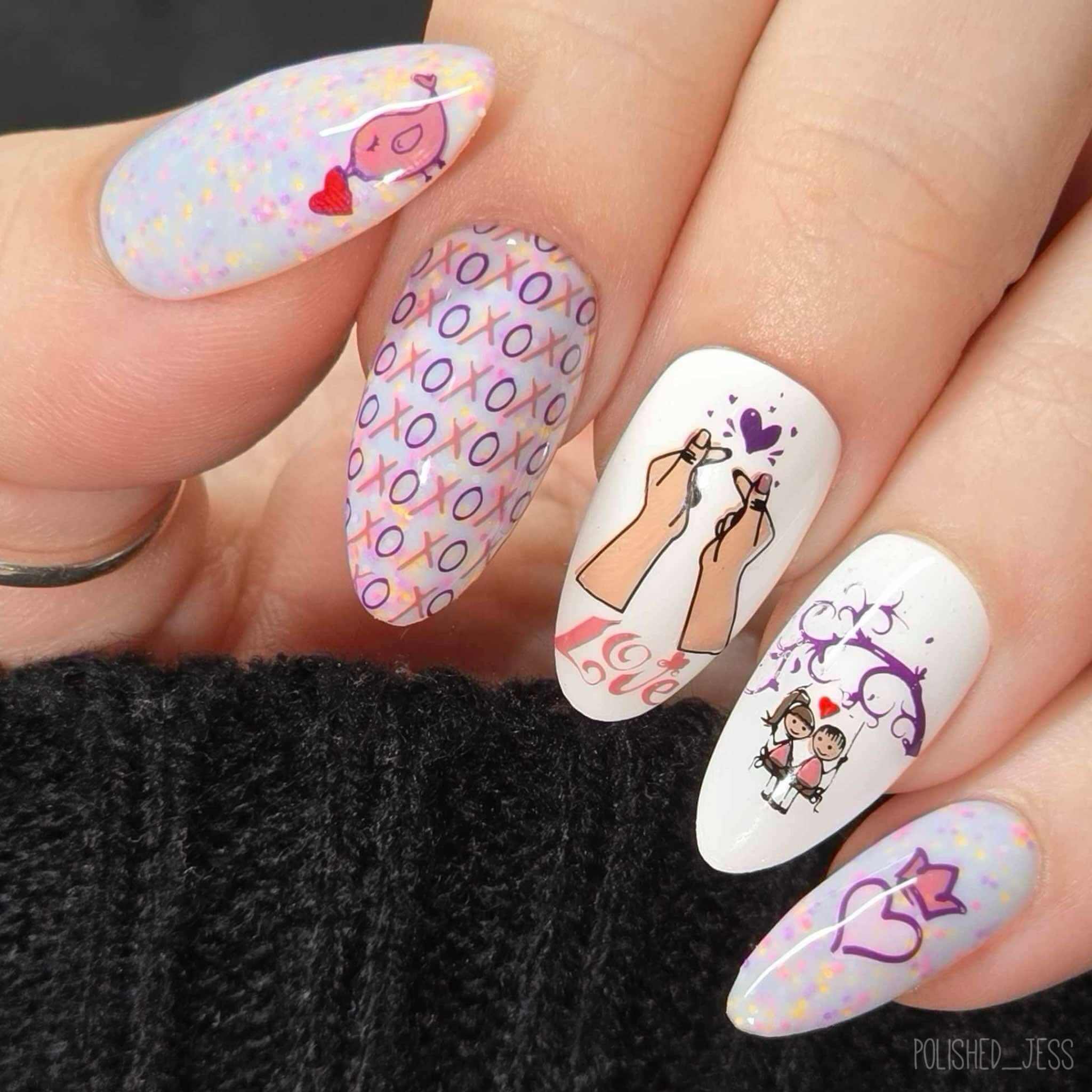 stunning-manicure-showing-valentines-nail-art-designs-of-a-cartoon-couple-on-a-swing-xo-and-a-love-bird