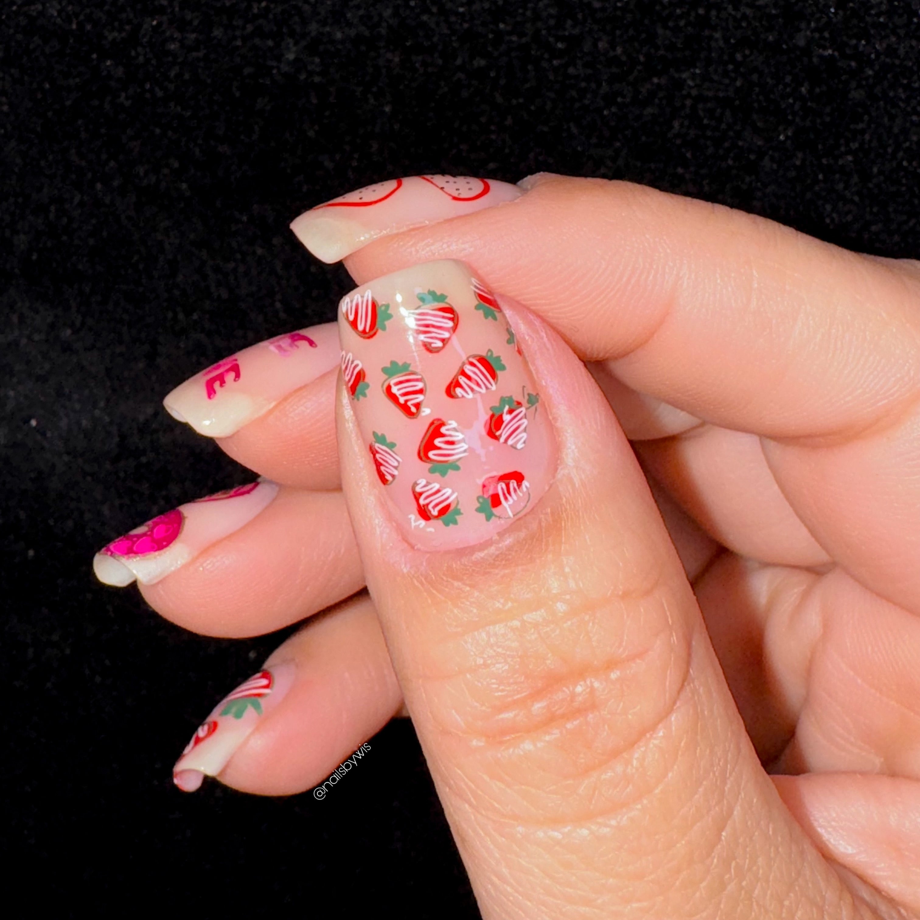 single-manicured-thumb-nail-with-cute-nail-art-designs-of-mini-chocolate-covered-strawberries