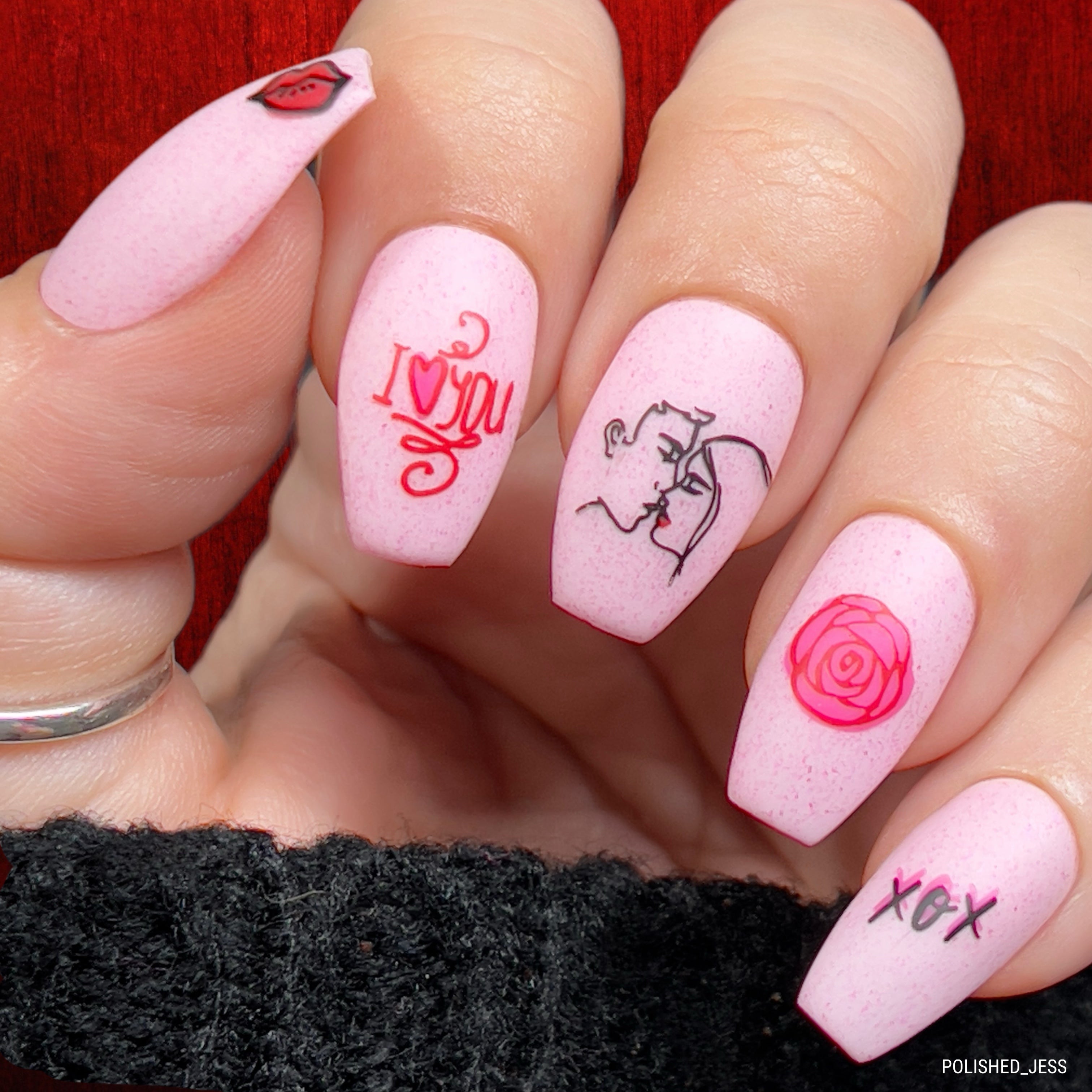 manicured-handed-with-elegant-nail-art-designs-of-a-couple-kissing-a-rose-and-the-words-i-love-you