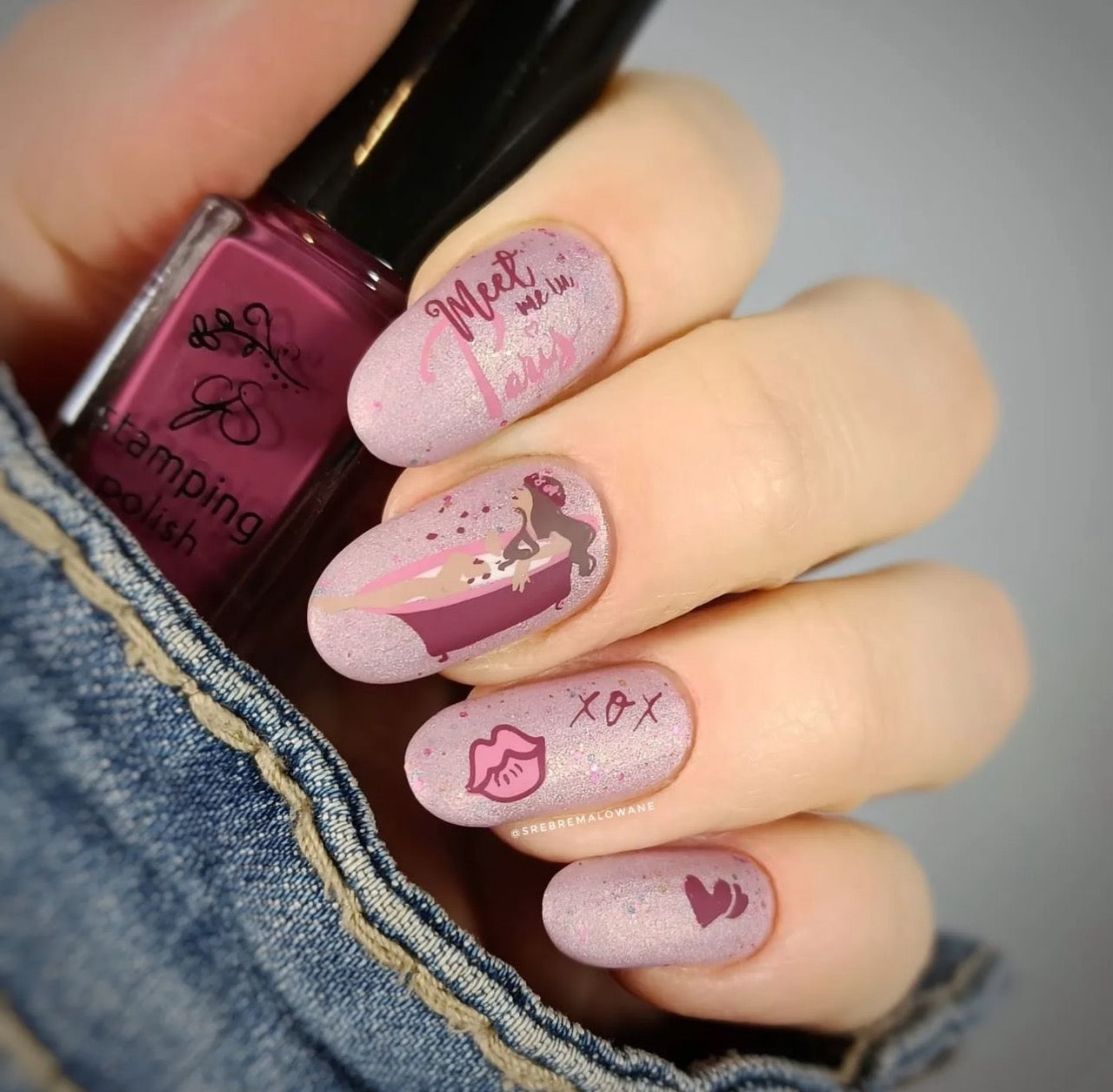 manicured-hand-with-stunning-nail-art-designs-of-a-girl-in-the-bath-lips-and-hearts-and-words-meet-me-in-paris